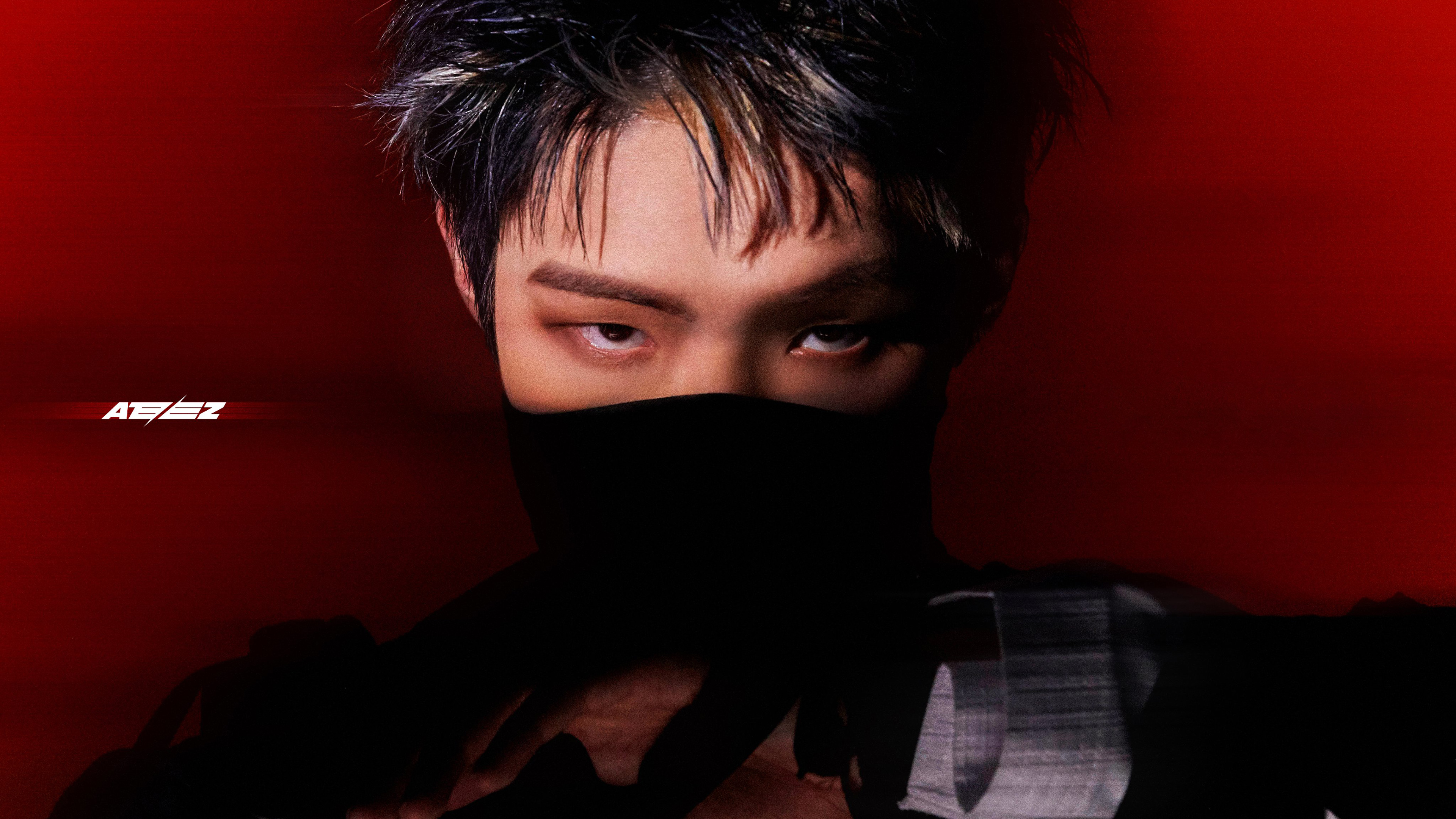 A powerful portrait of K-pop singer Mingi from ATEEZ with a deep red background