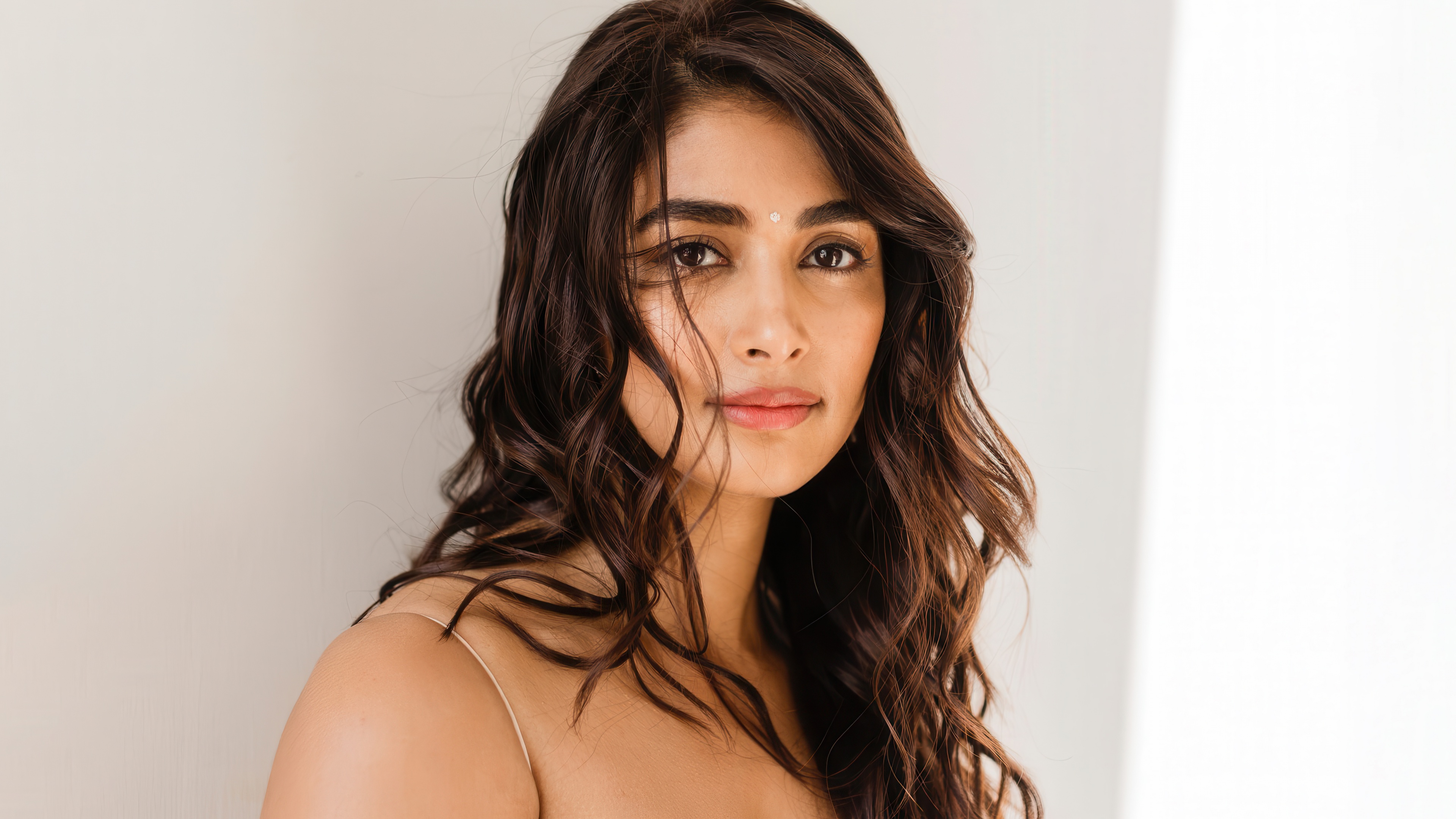 A high-definition closeup portrait of Indian actress Pooja Hegde.