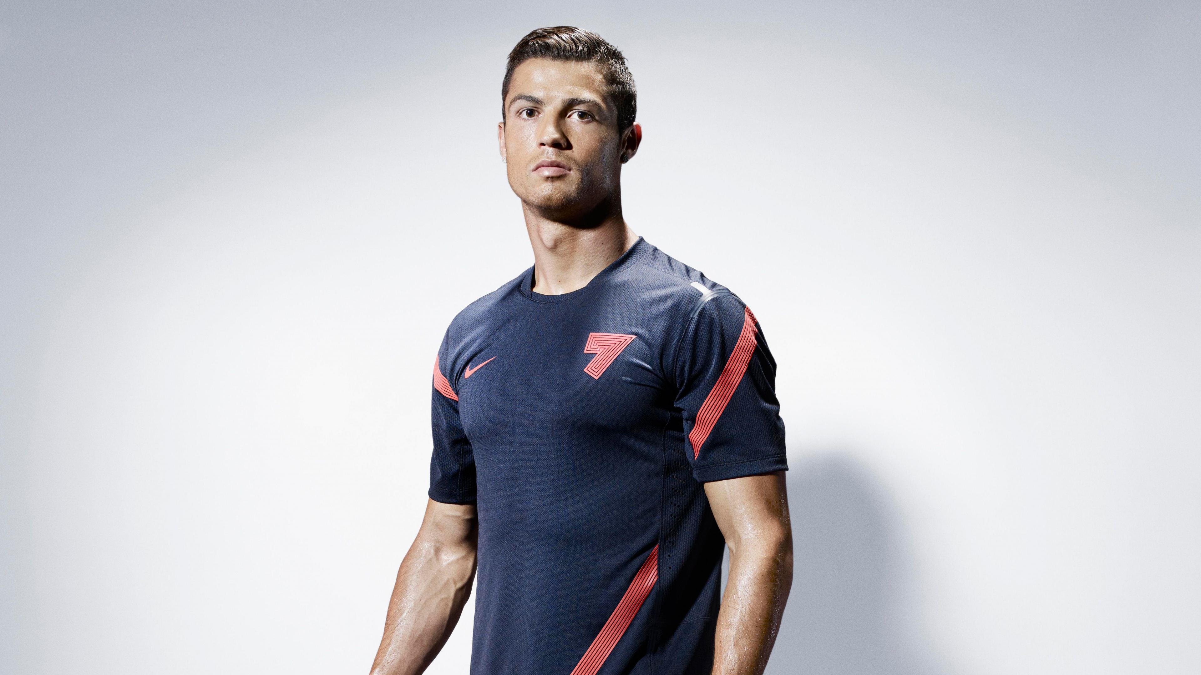 A high-resolution sports poster of Cristiano Ronaldo in Nike gear, celebrating the Portuguese football icon.
