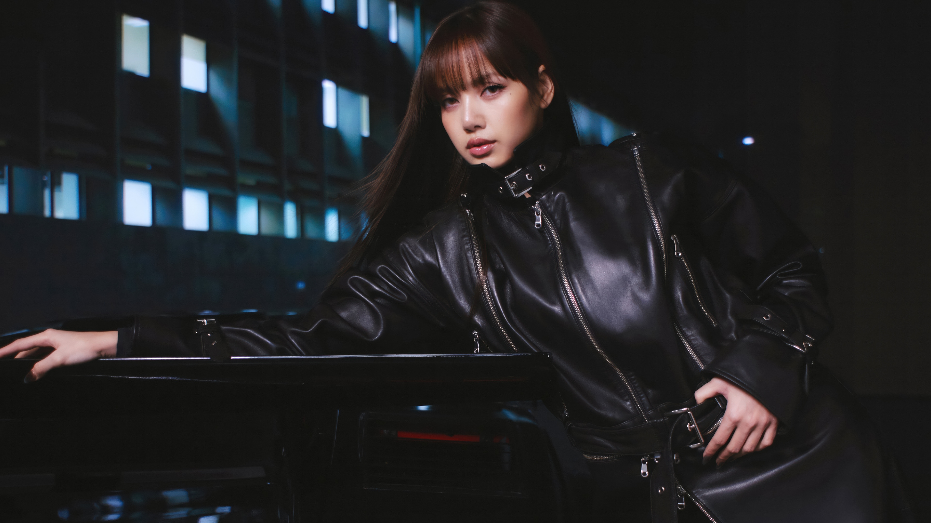 A high-resolution, elegant portrait of Lisa wearing a sleek black dress.