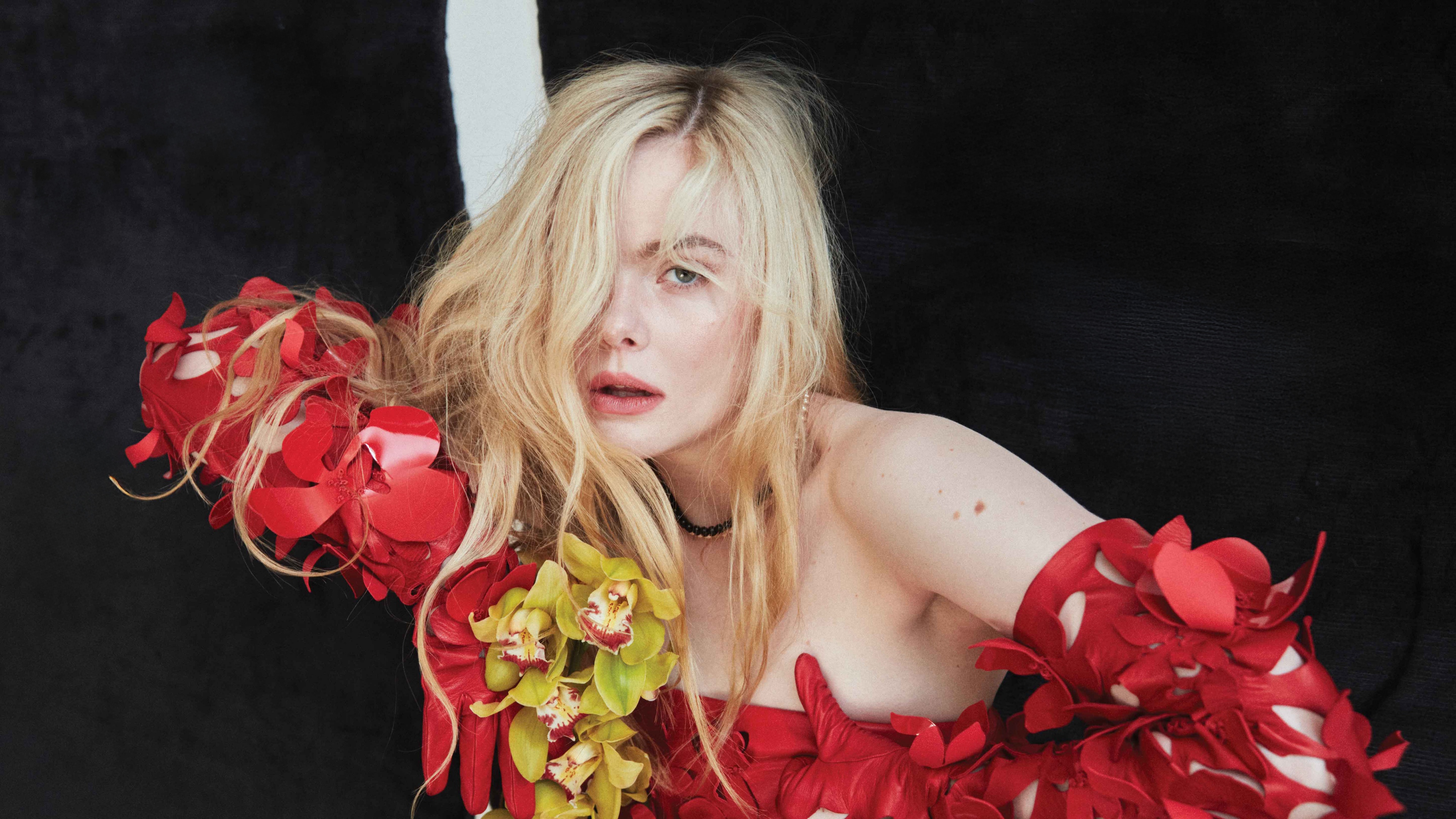 A high-resolution 5K portrait of Elle Fanning wearing a beautiful floral print dress with blonde hair.