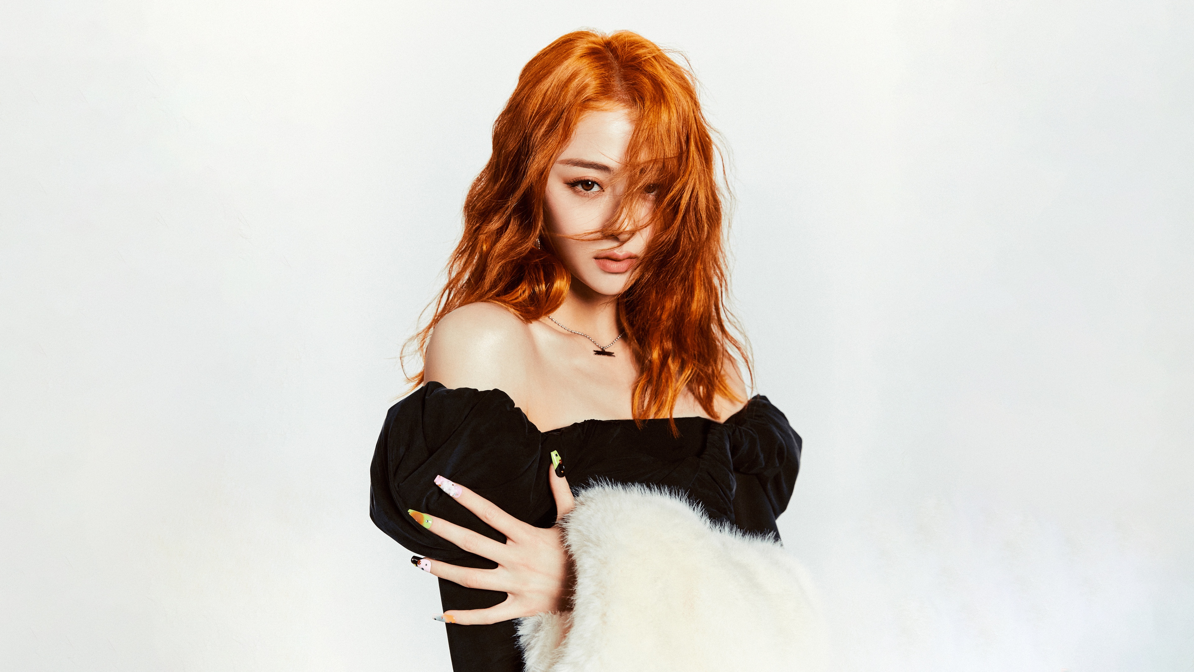 High-resolution portrait of South Korean singer Huh Yunjin from Le Sserafim on a white background