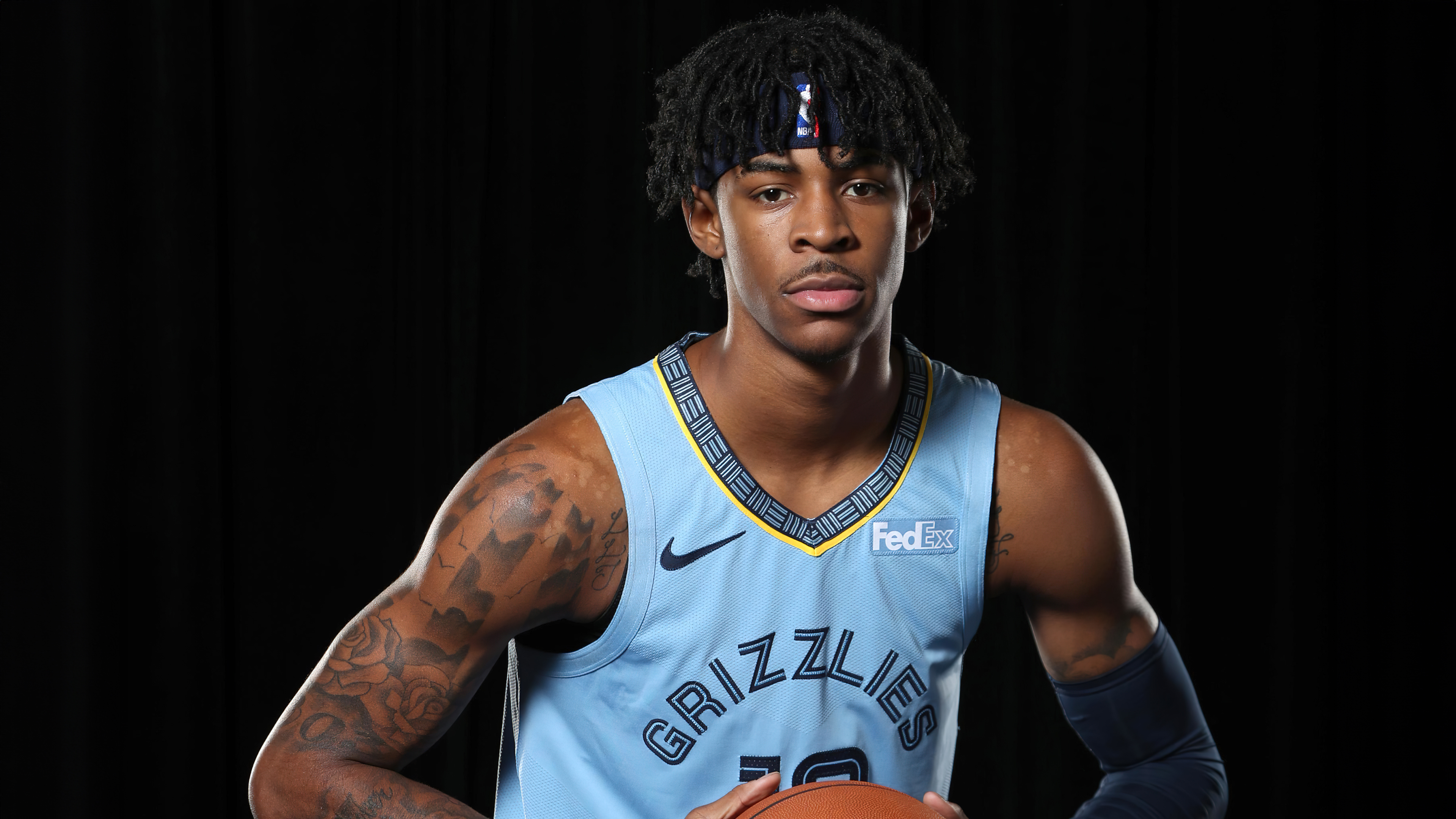 Ja Morant of the Memphis Grizzlies basketball player against a solid black background