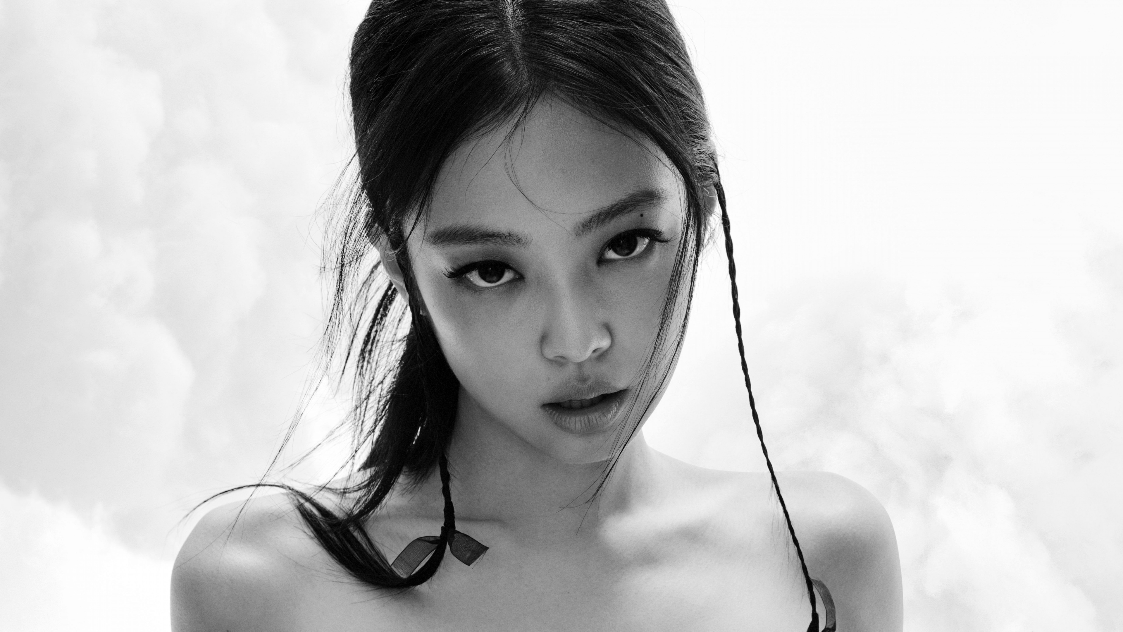 Close-up black and white portrait of Jennie Kim from BLACKPINK in an Elle Magazine style photoshoot.