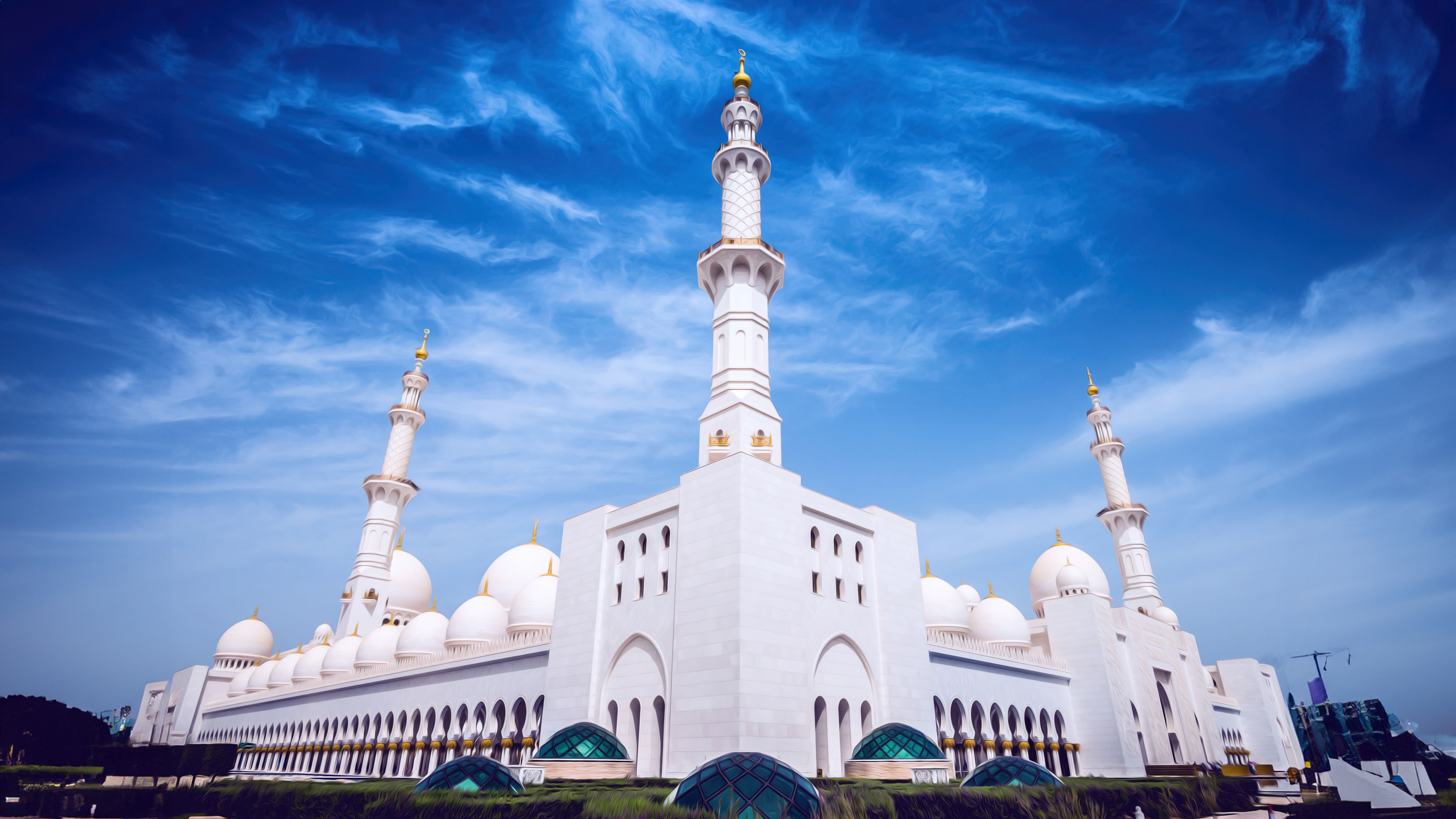 A detailed view of the stunning white marble domes and intricate Islamic architecture of the Sheikh Zayed Grand Mosque in Abu Dhabi, UAE.