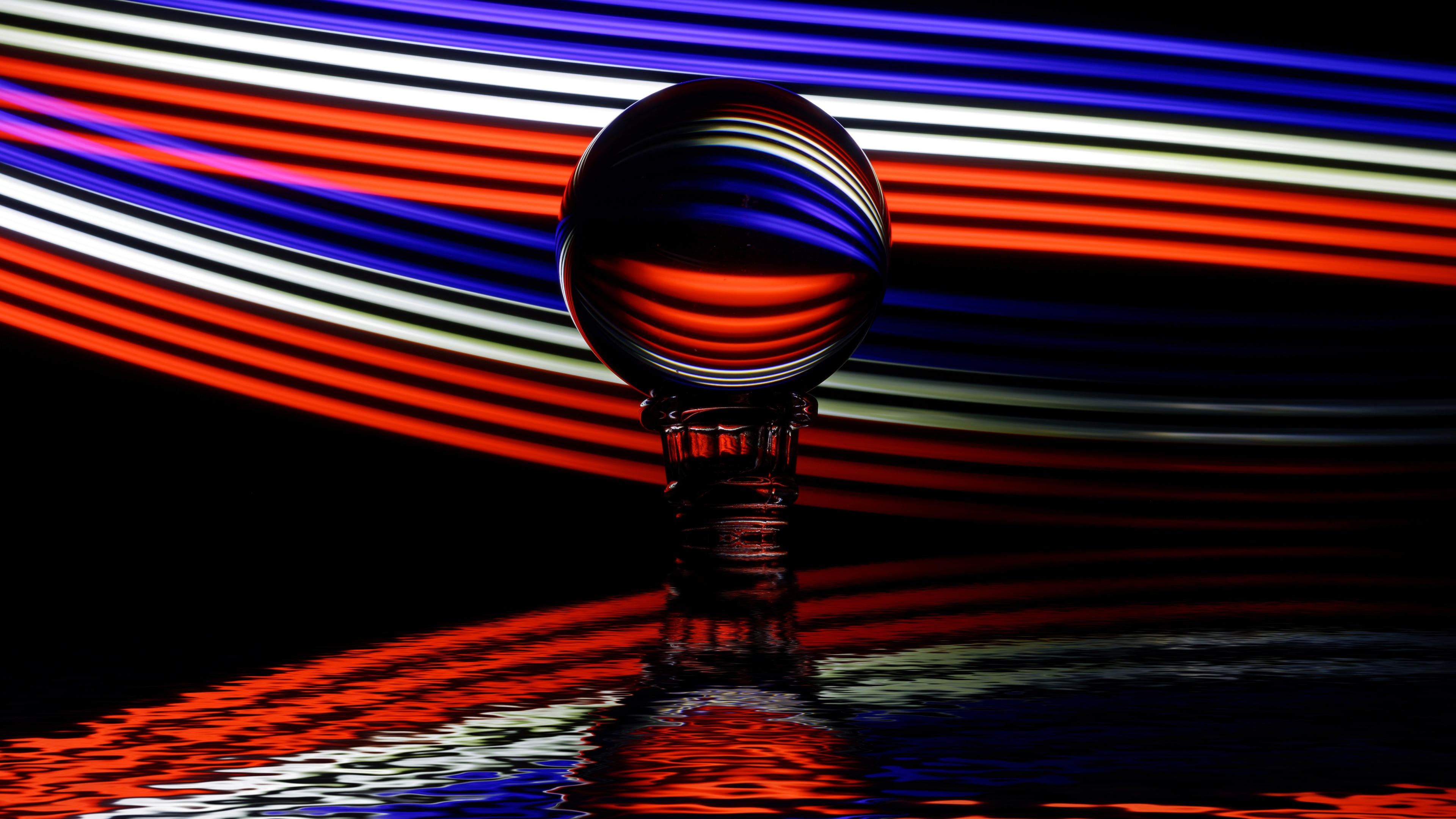 A highly detailed crystal ball displaying vibrant multicolor light reflections and prismatic patterns.
