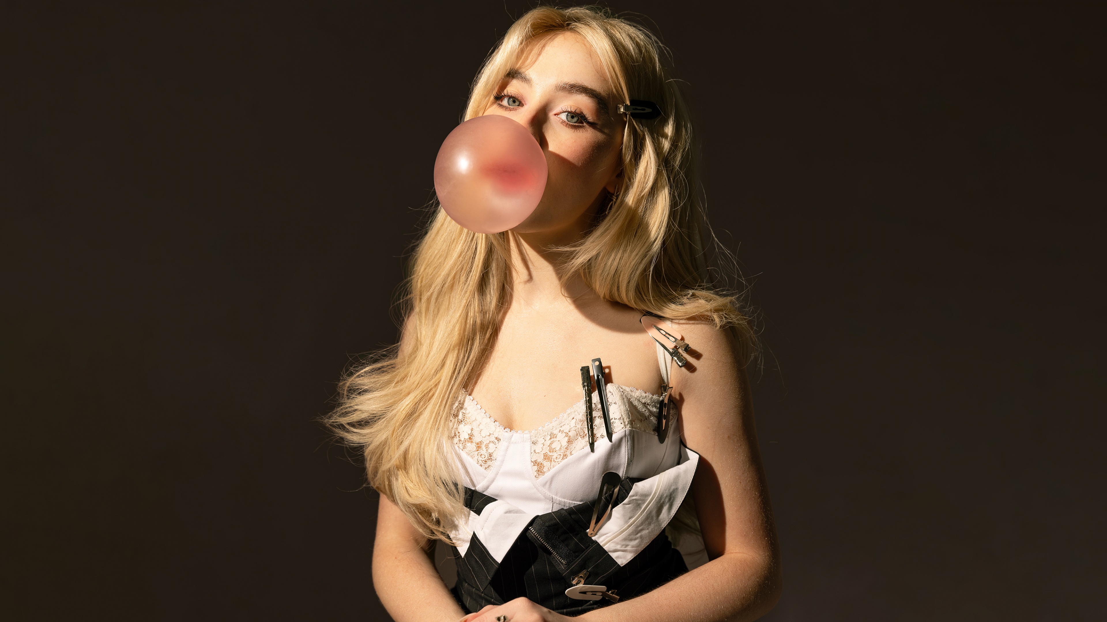 A professional studio portrait of Sabrina Carpenter for a Rolling Stone magazine feature.