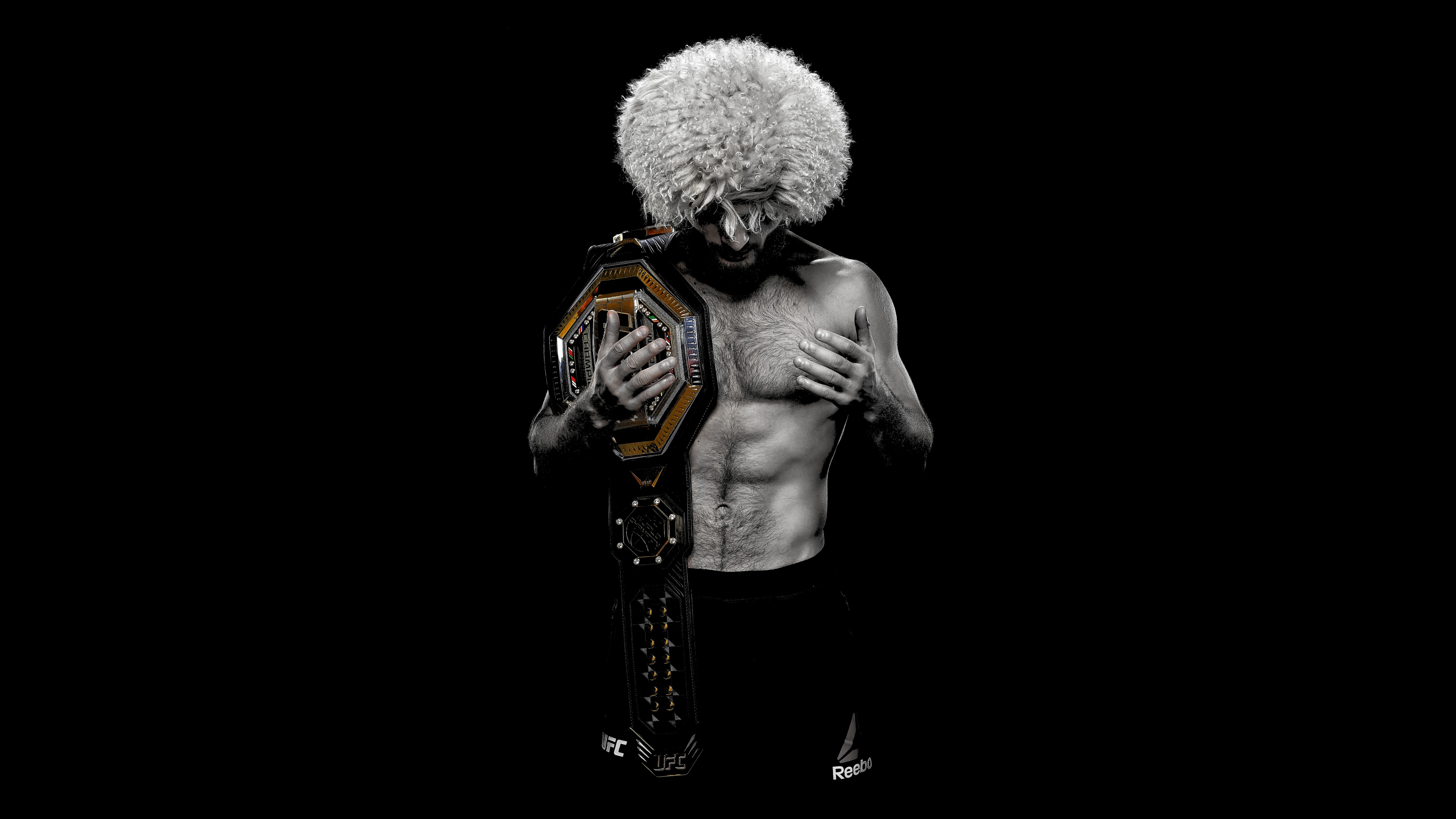A high-contrast, cinematic portrait of a muscular MMA champion celebrating a victory against a solid black background.