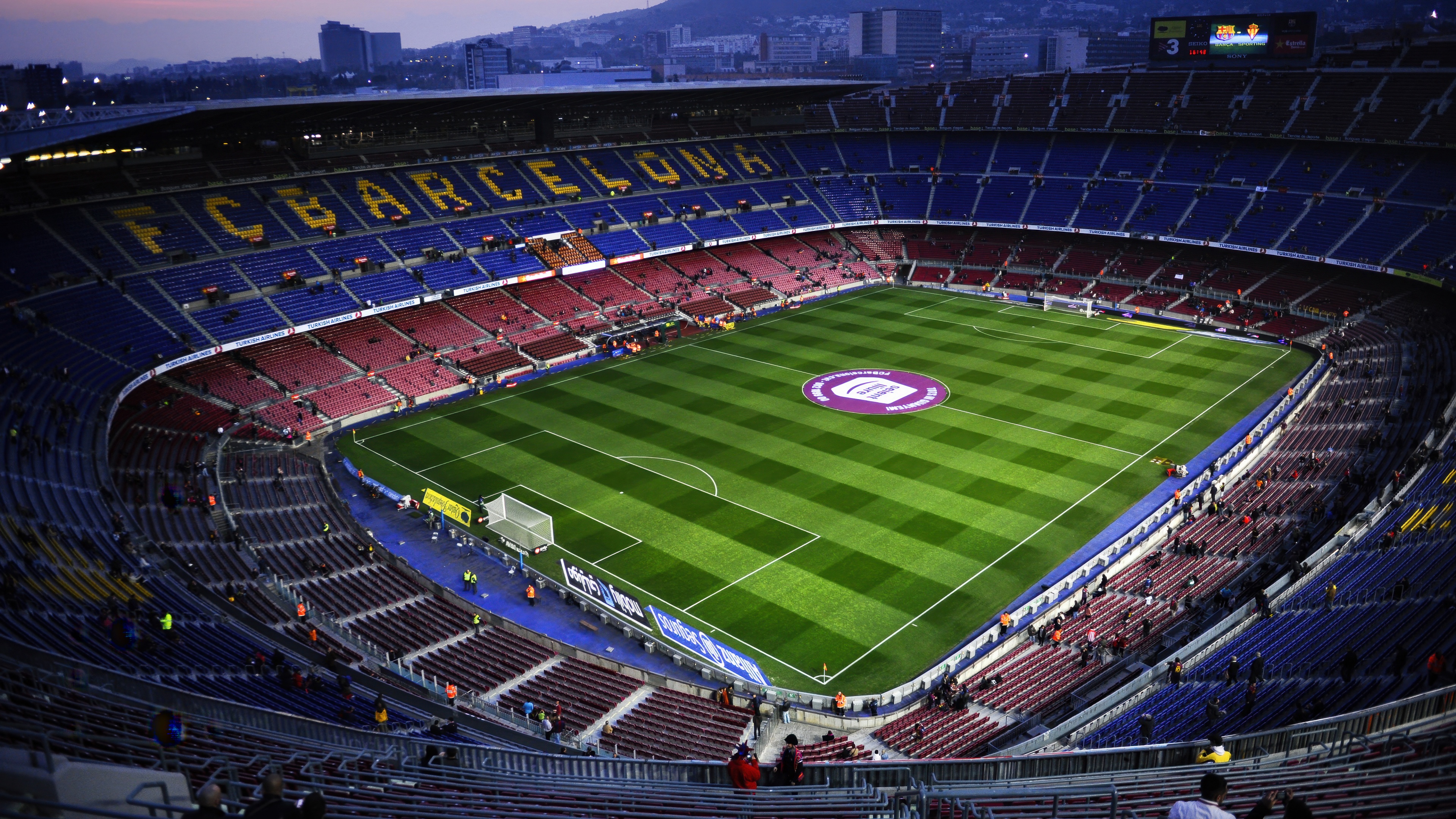A wide-angle, high-resolution view of the massive Camp Nou football stadium in Barcelona, Spain.