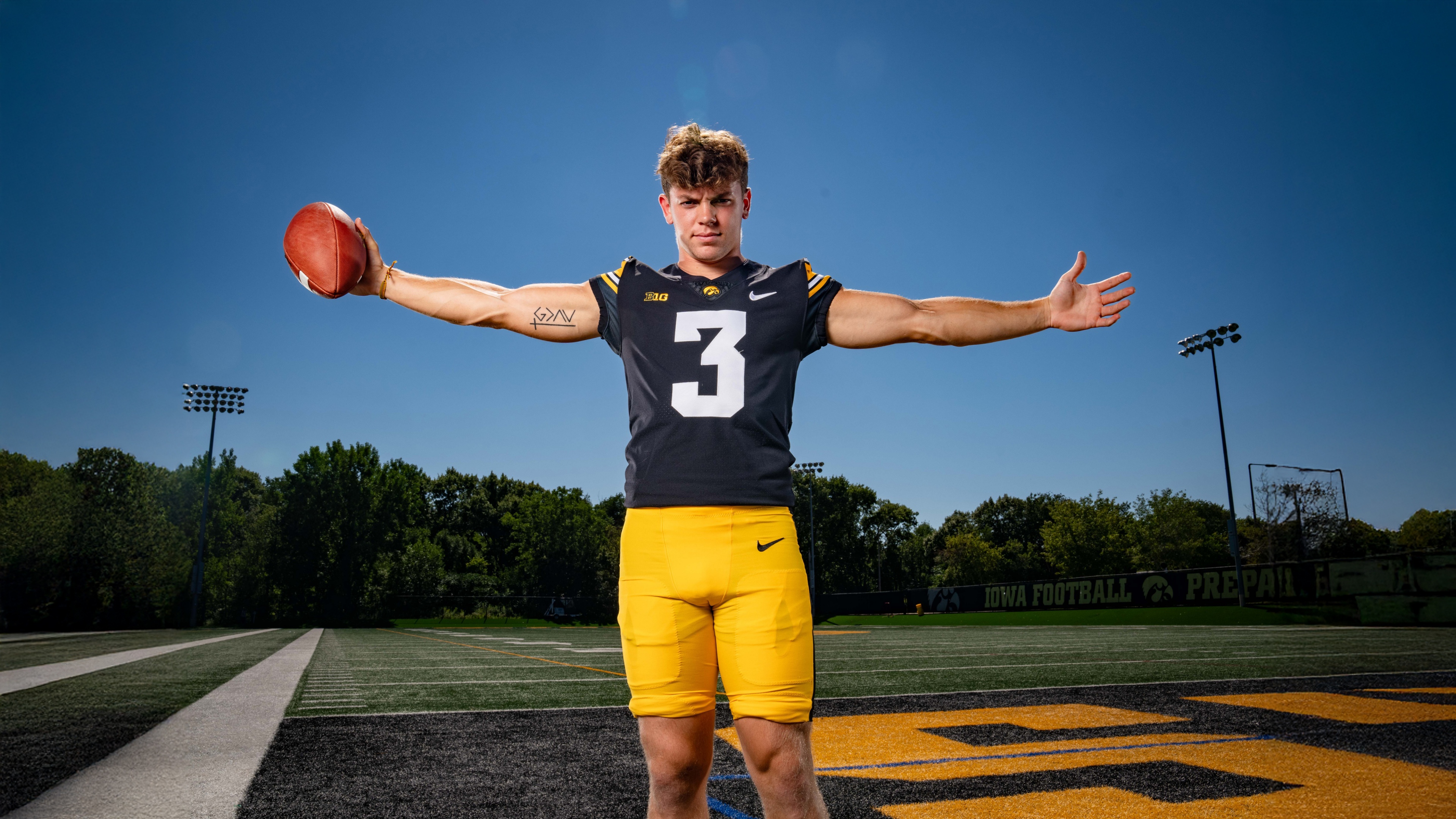 Close-up portrait of Iowa Hawkeyes football player Cooper DeJean wearing Nike athletic apparel.