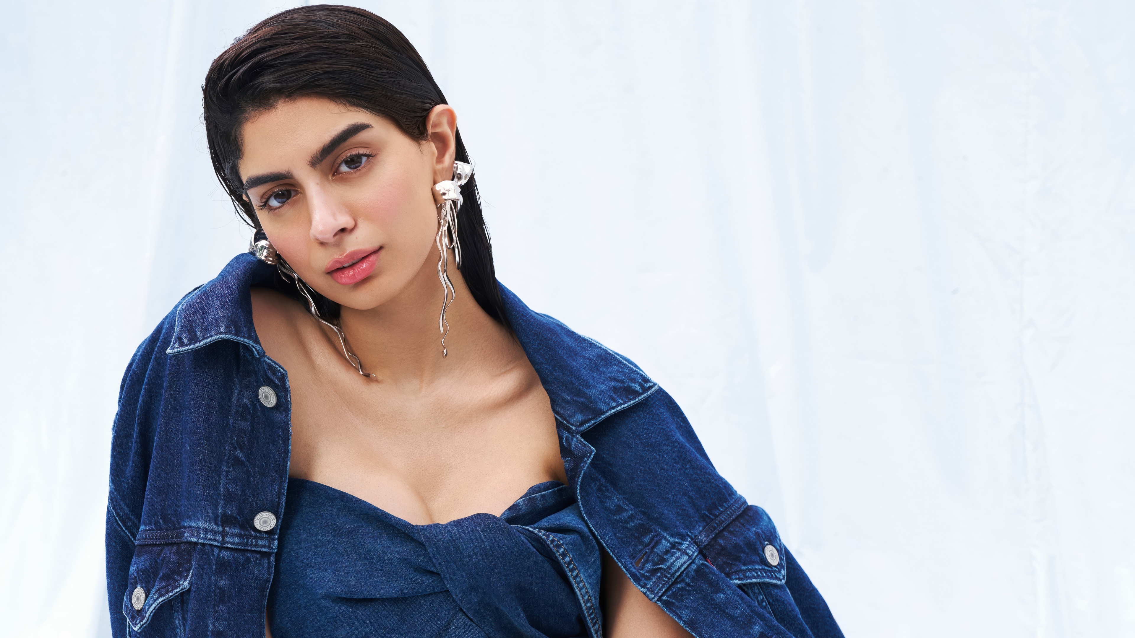 Indian actress Khushi Kapoor posing in a stylish and trendy denim outfit during a glamorous photoshoot.