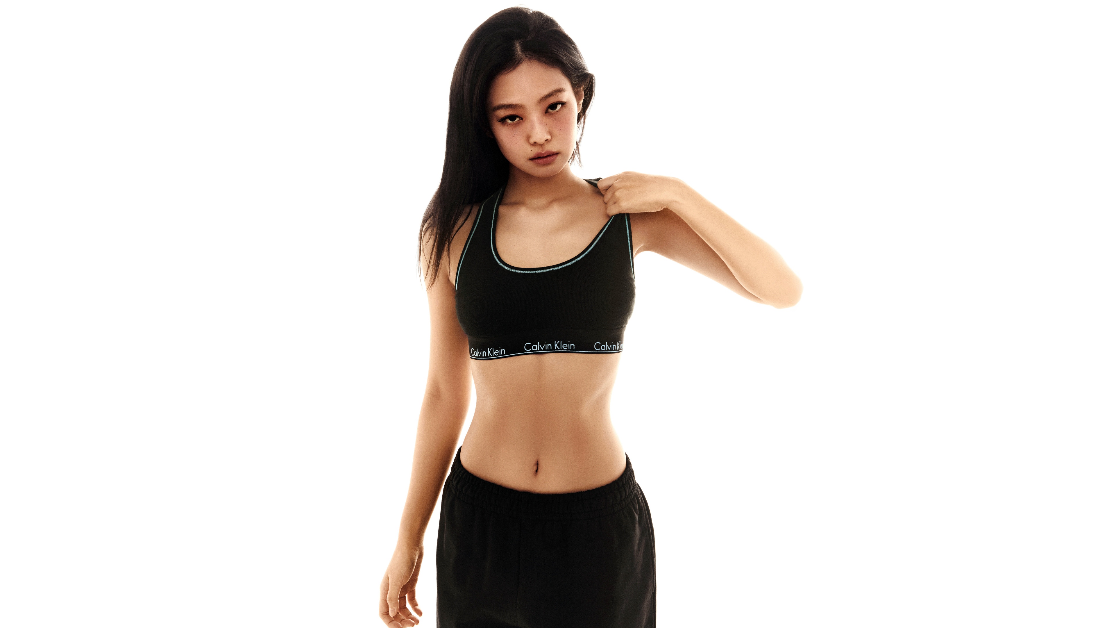 Jennie Kim from BLACKPINK posing for a Calvin Klein inspired fashion photoshoot against a white background