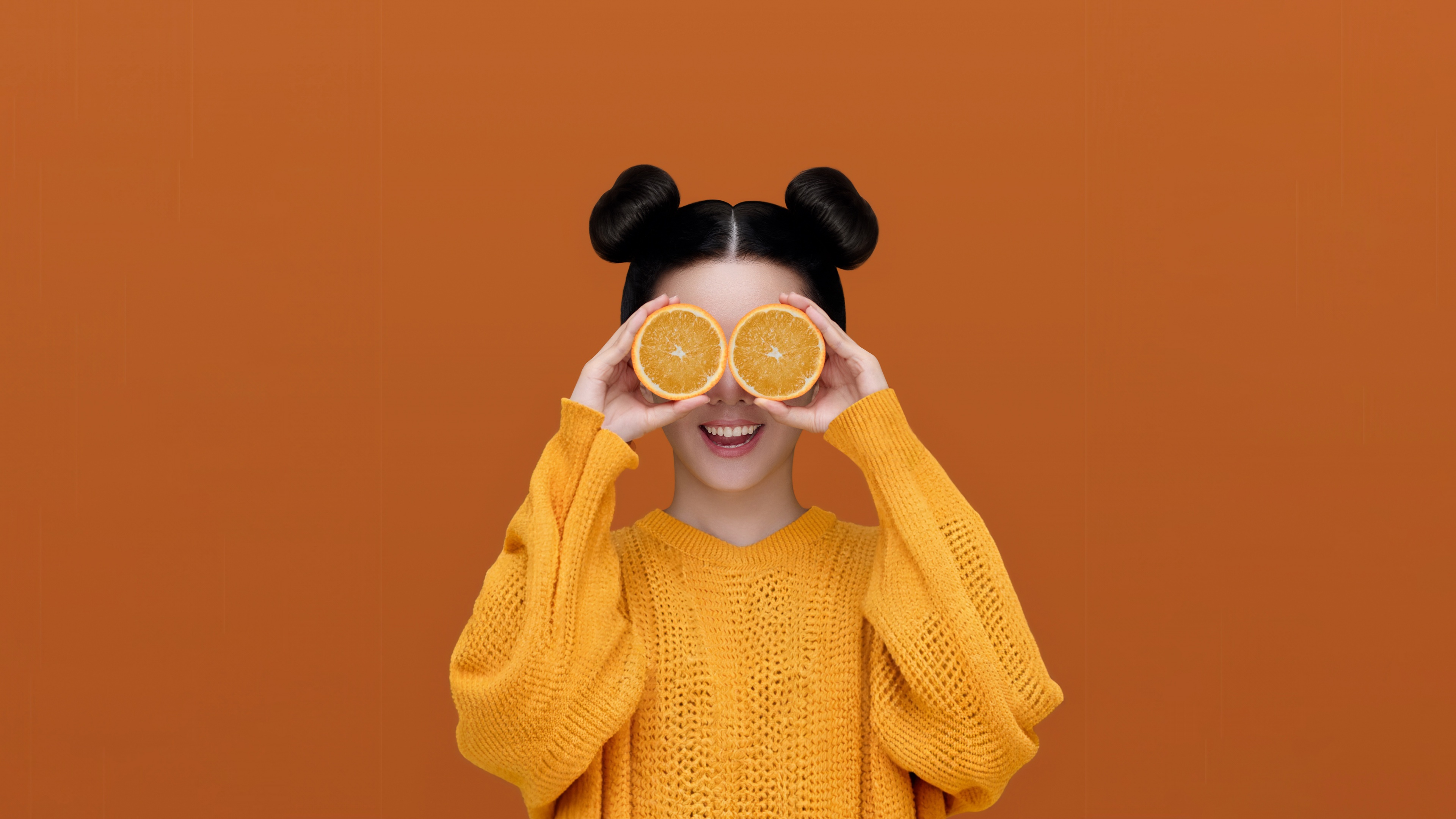 A high-resolution portrait of a girl presented in a vibrant, monochromatic orange aesthetic.