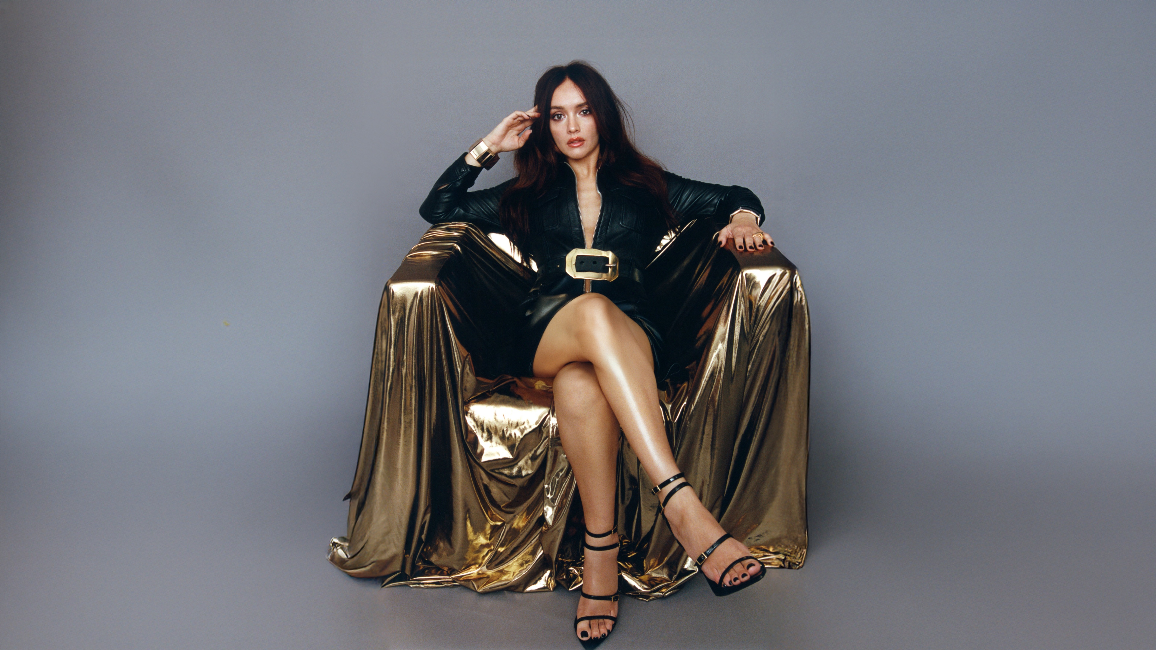 A high-fashion editorial portrait of actress Olivia Cooke for an ELLE magazine photoshoot, featuring elegant styling and professional studio lighting.