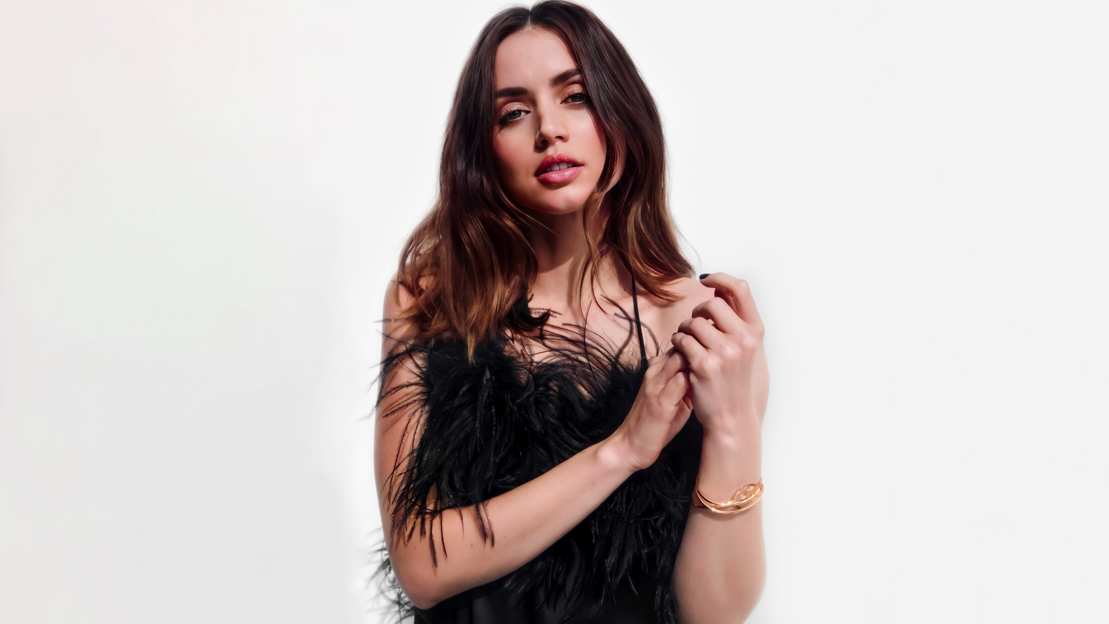 A high-quality close-up portrait of actress Ana de Armas on a solid white background.
