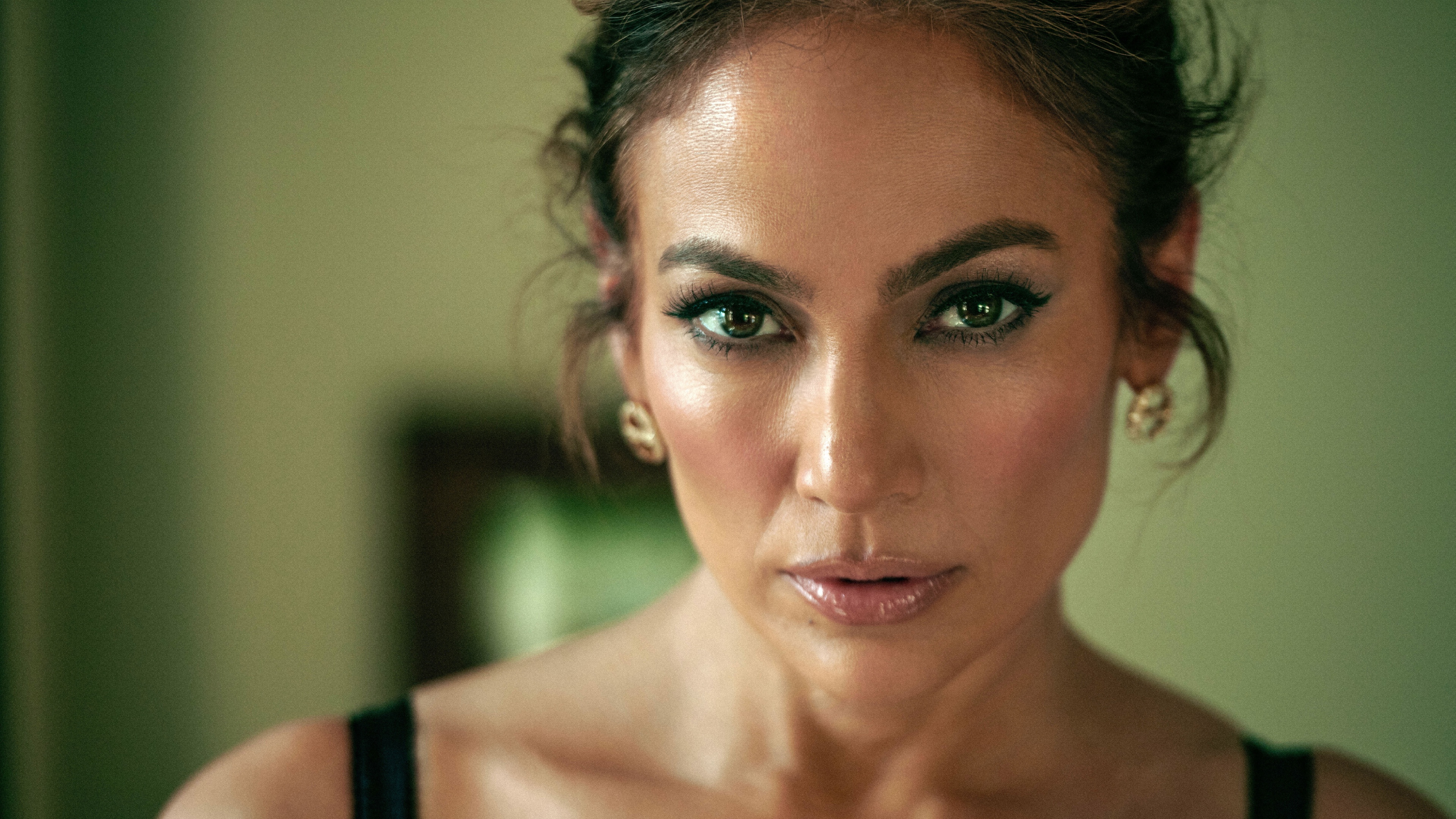 A high-detail close-up portrait of Jennifer Lopez with professional lighting and 8K resolution.