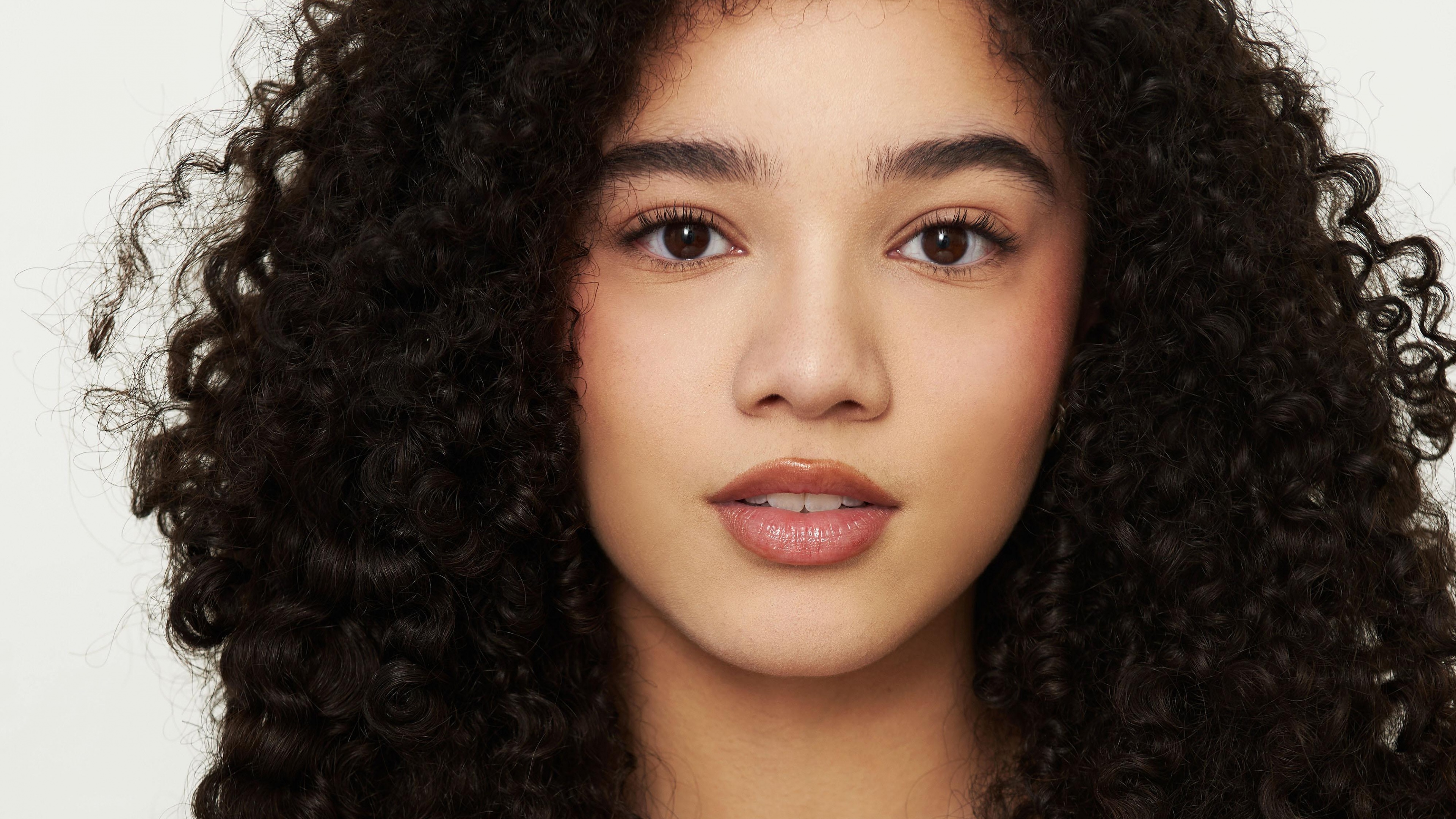 A professional portrait of Canadian actress Malia Baker looking directly at the camera.