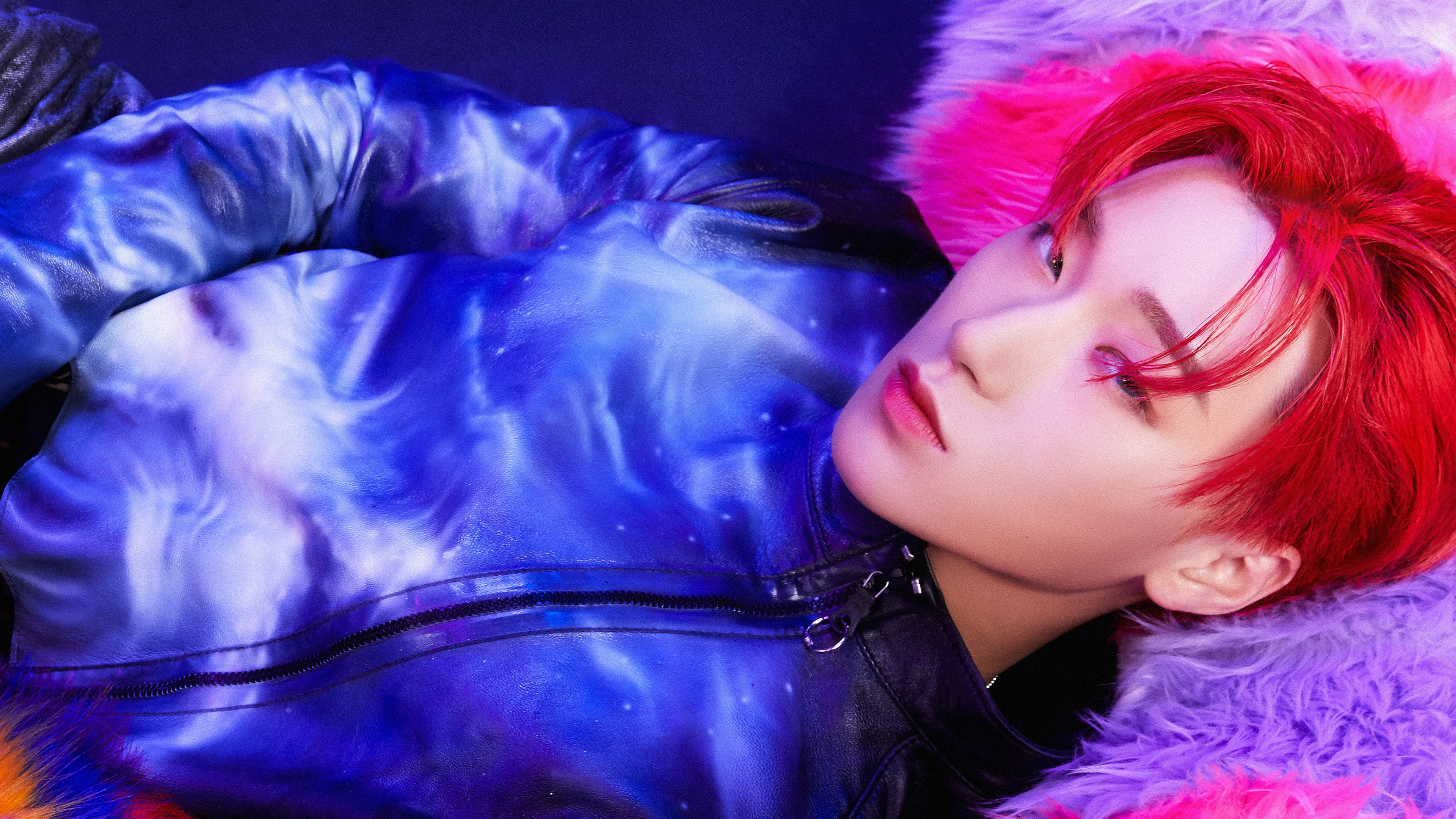 Portrait of San from ATEEZ with vibrant red hair and K-pop idol styling.