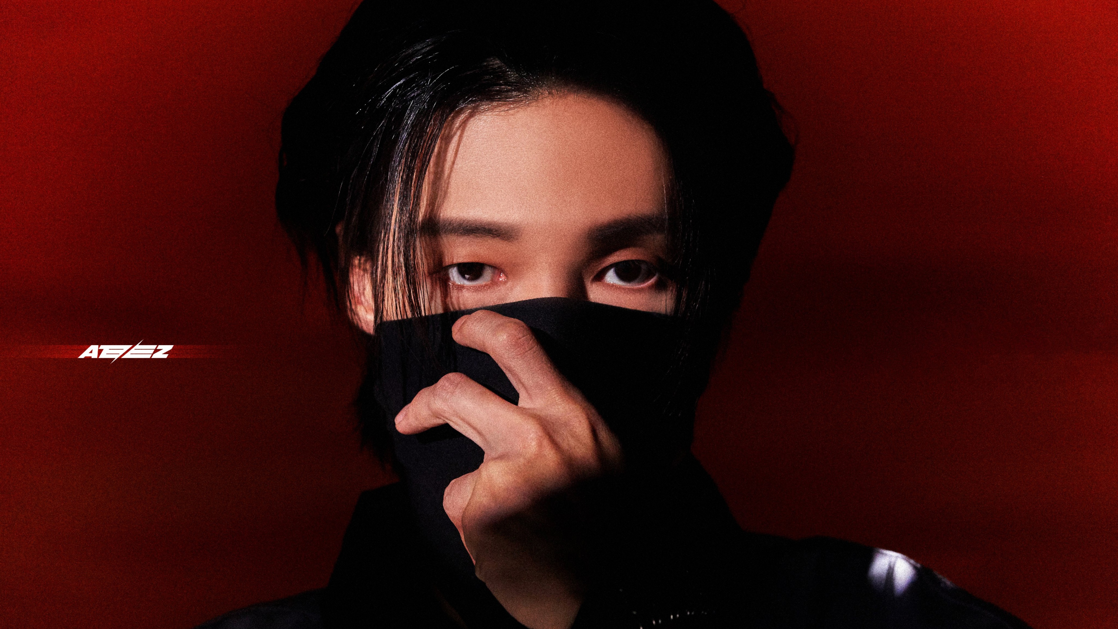 A close-up portrait of Wooyoung, the South Korean singer from the K-pop group ATEEZ.
