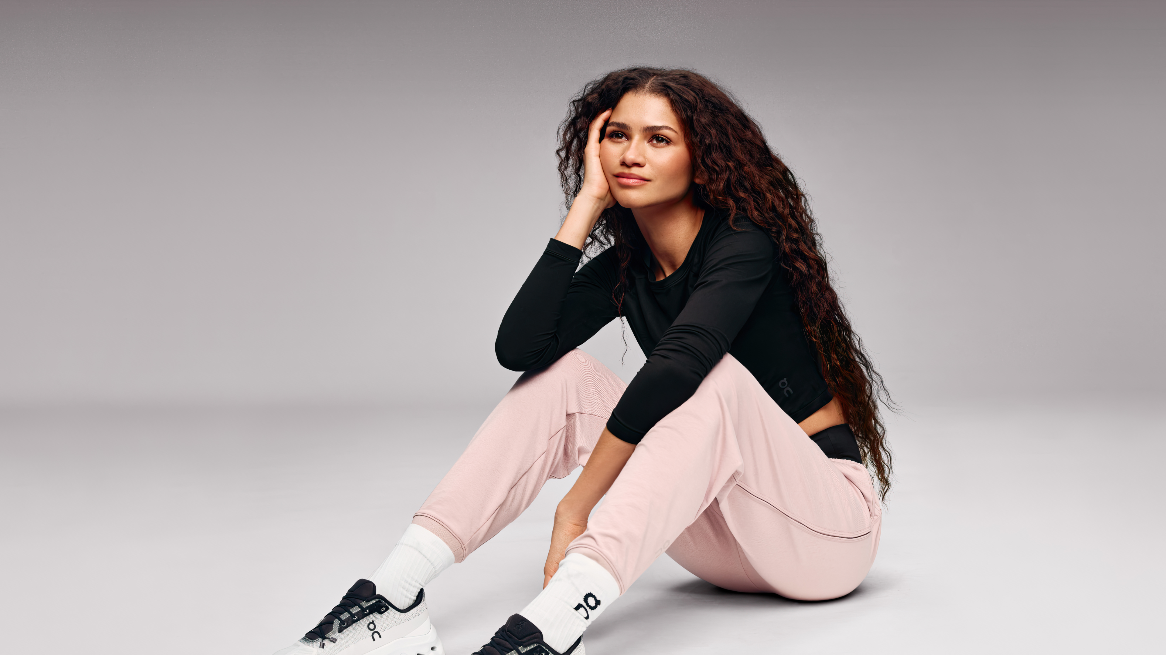 A close-up, joyful portrait of American actress Zendaya smiling.