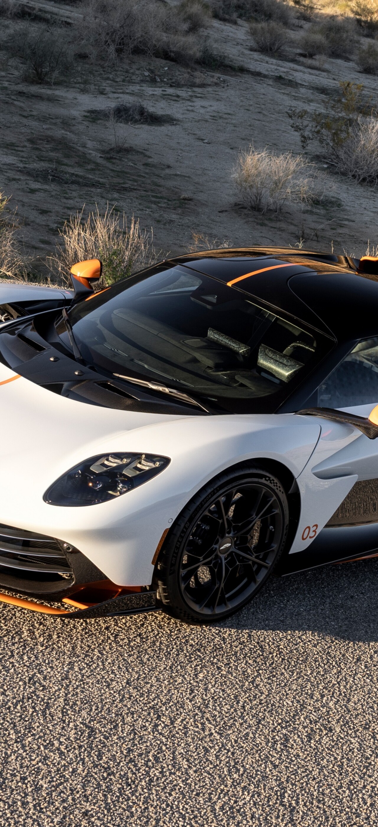 A sleek and aerodynamic white 2025 Aston Martin Valhalla plug-in hybrid supercar.