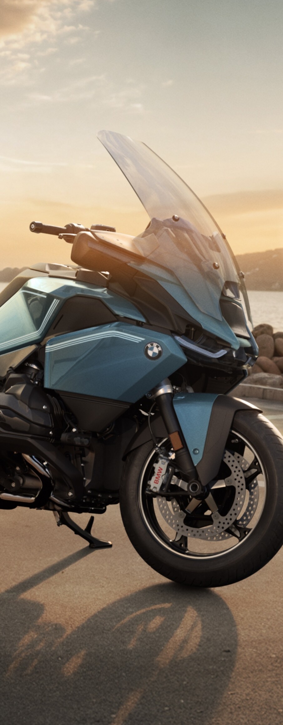 A close-up view of the 2025 BMW R 1300 RT touring motorcycle, highlighting its aerodynamic design and modern features.