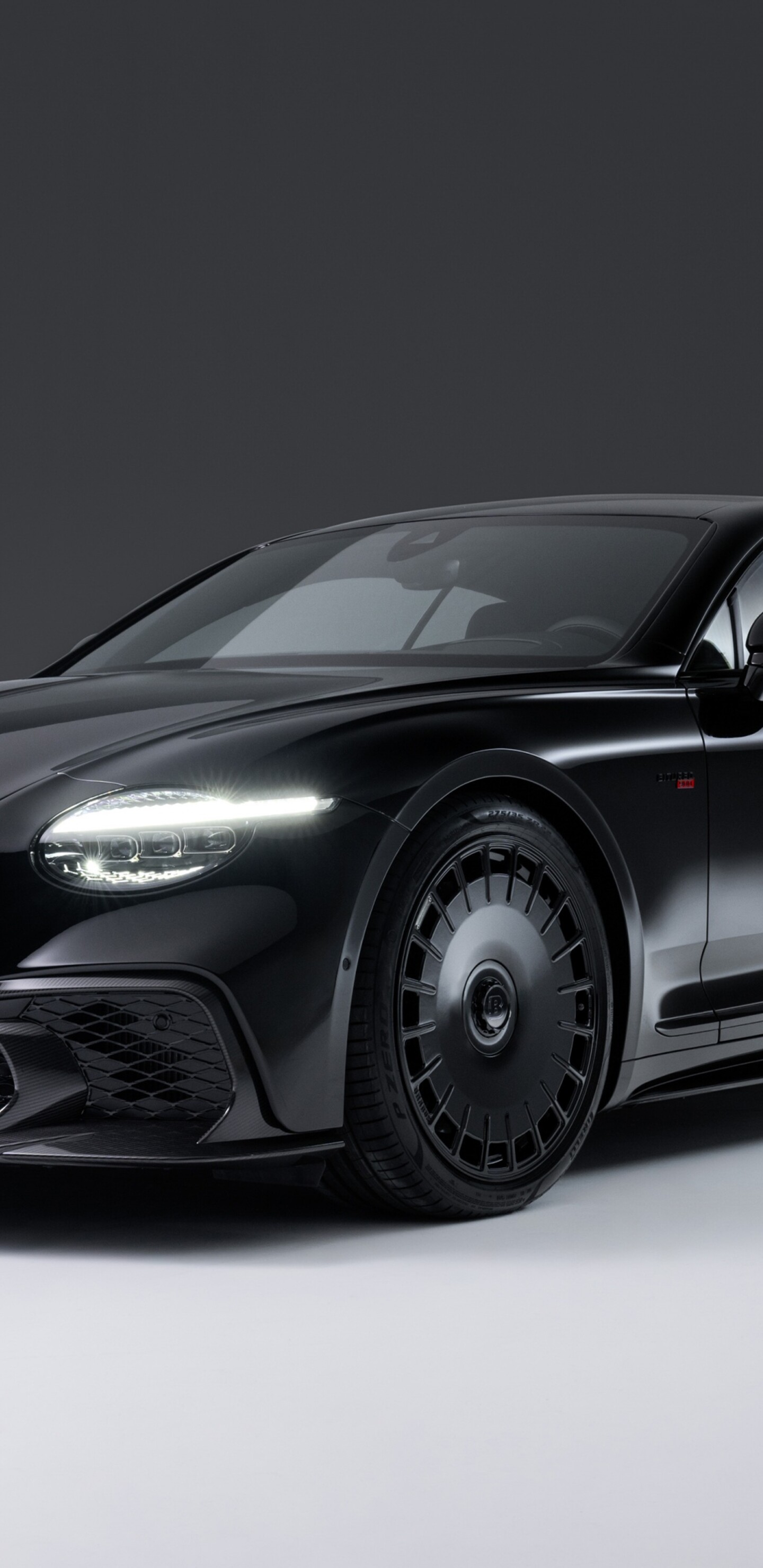 A sleek and aggressive all-black 2025 Brabus 900 Superblack Bentley Continental GT Speed luxury car.