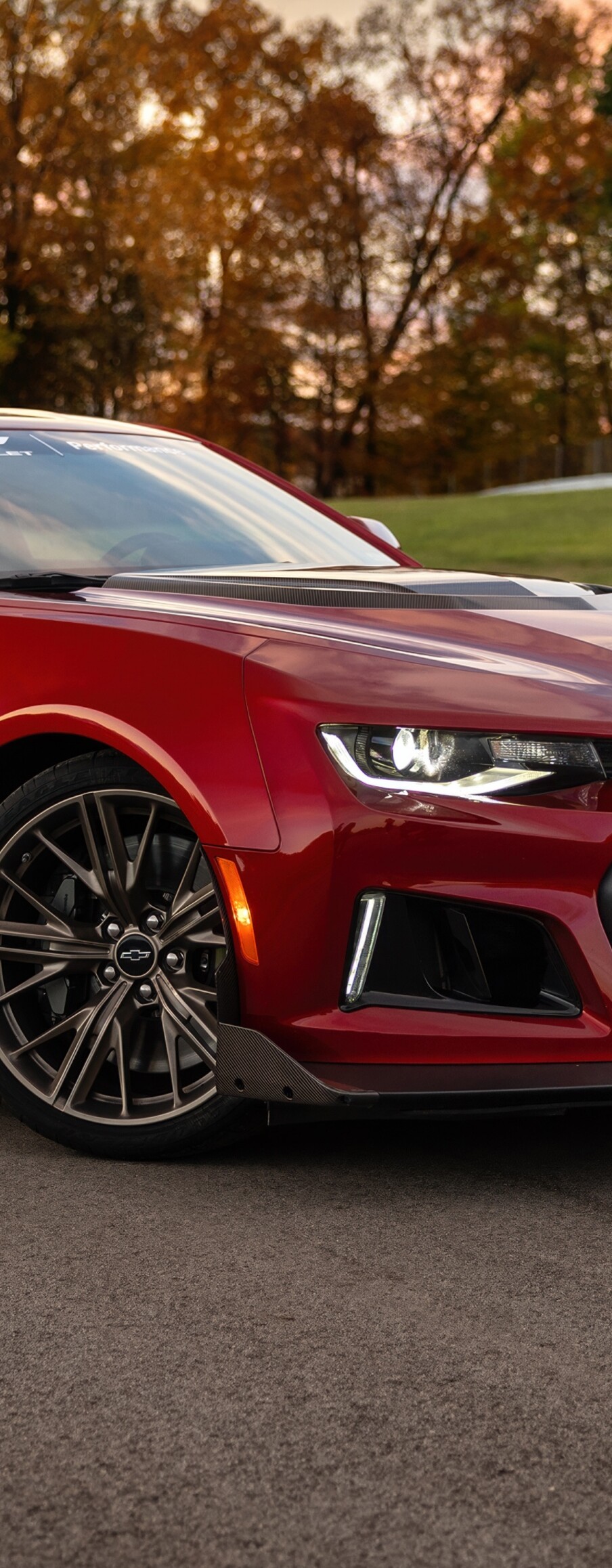 A high-detail shot of a 2025 Chevrolet Camaro ZL1 parked on a clean asphalt road.