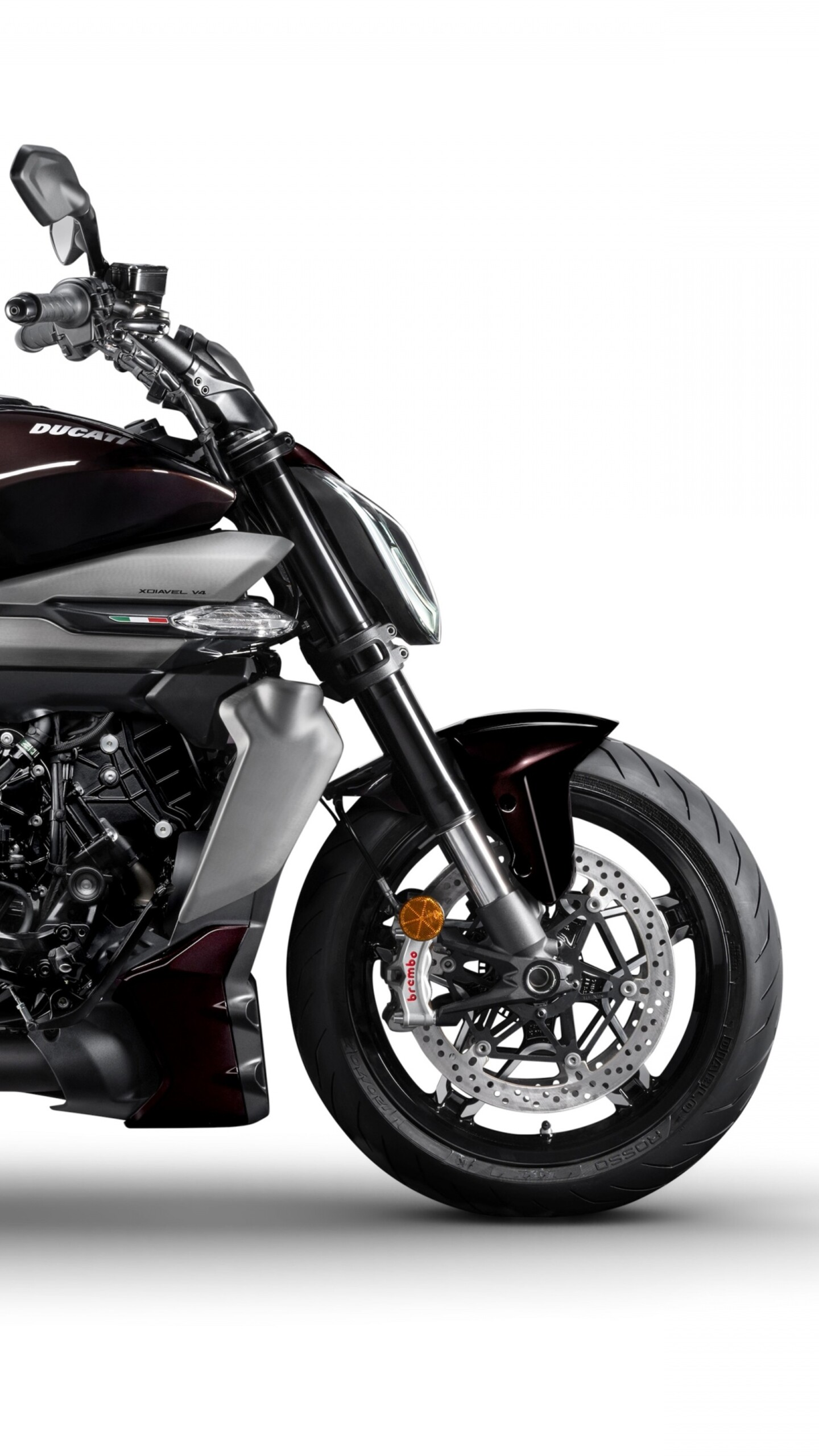 A sleek 2025 Ducati XDiavel V4 motorcycle isolated on a solid white background.