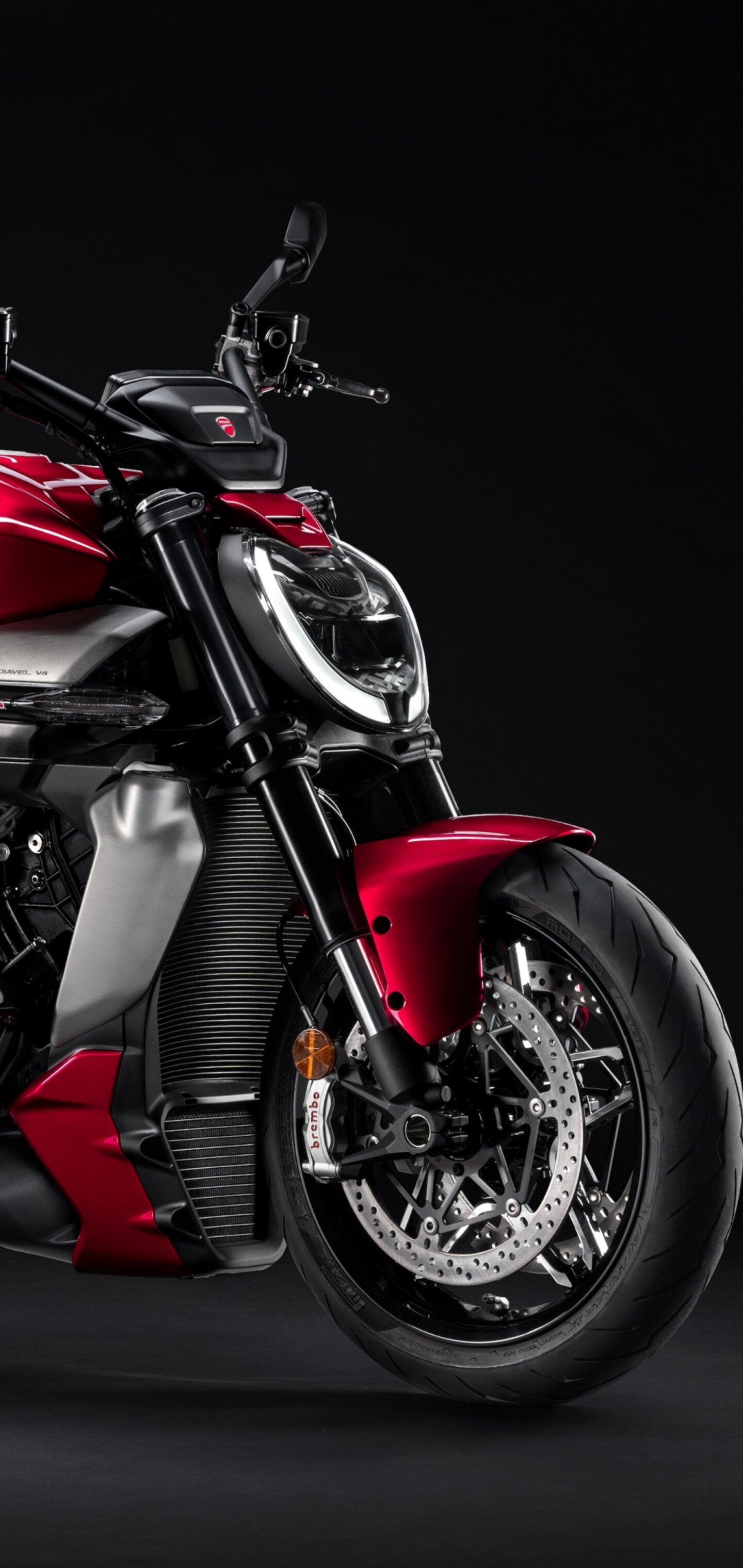 A high-detail 5K image of a 2025 Ducati XDiavel V4 sports bike featuring a sleek design on a dark background.
