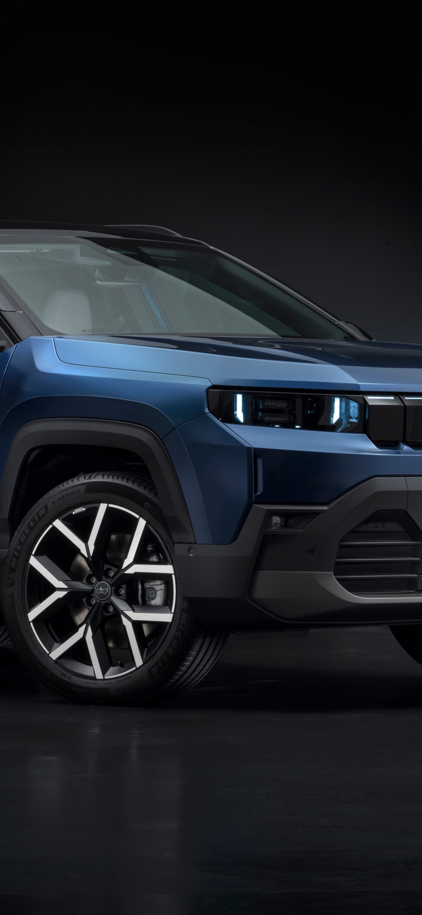 A high-resolution 8K close-up of the 2025 Jeep Compass e SUV featuring a sleek design against a dark, moody background.