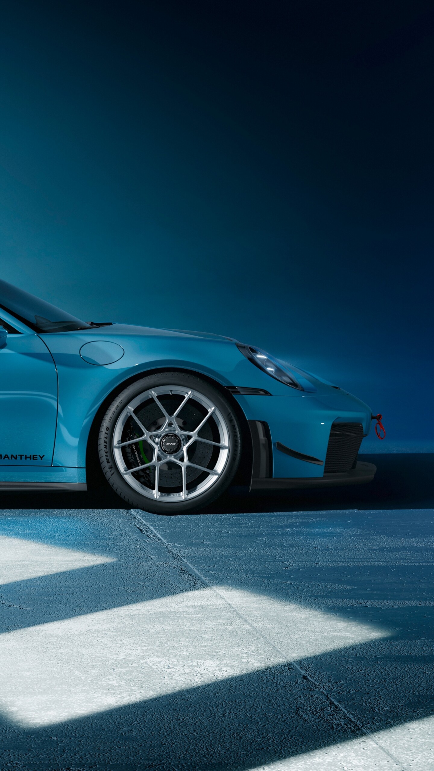 A high-resolution, cinematic shot of a 2025 Porsche 911 GT3 featuring a sleek blue aesthetic and modern lighting.