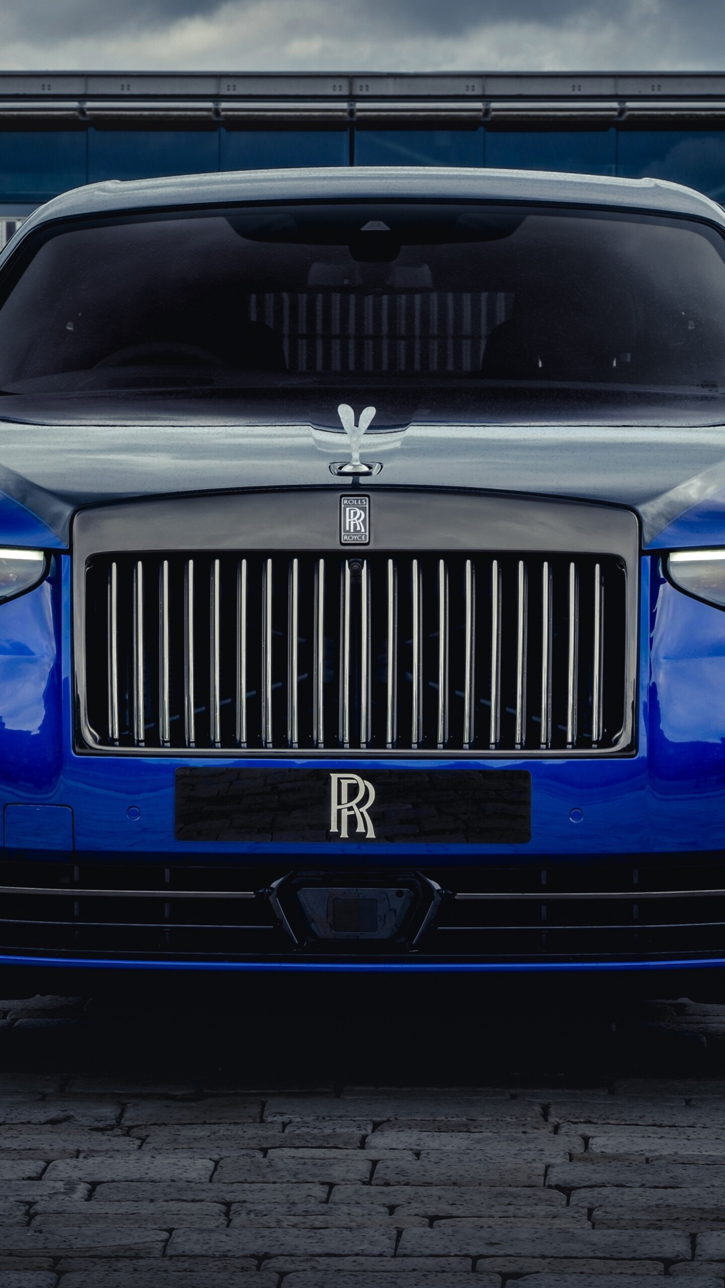 A luxurious 2025 Rolls-Royce Black Badge Ghost featuring a dark, polished finish and elegant design.