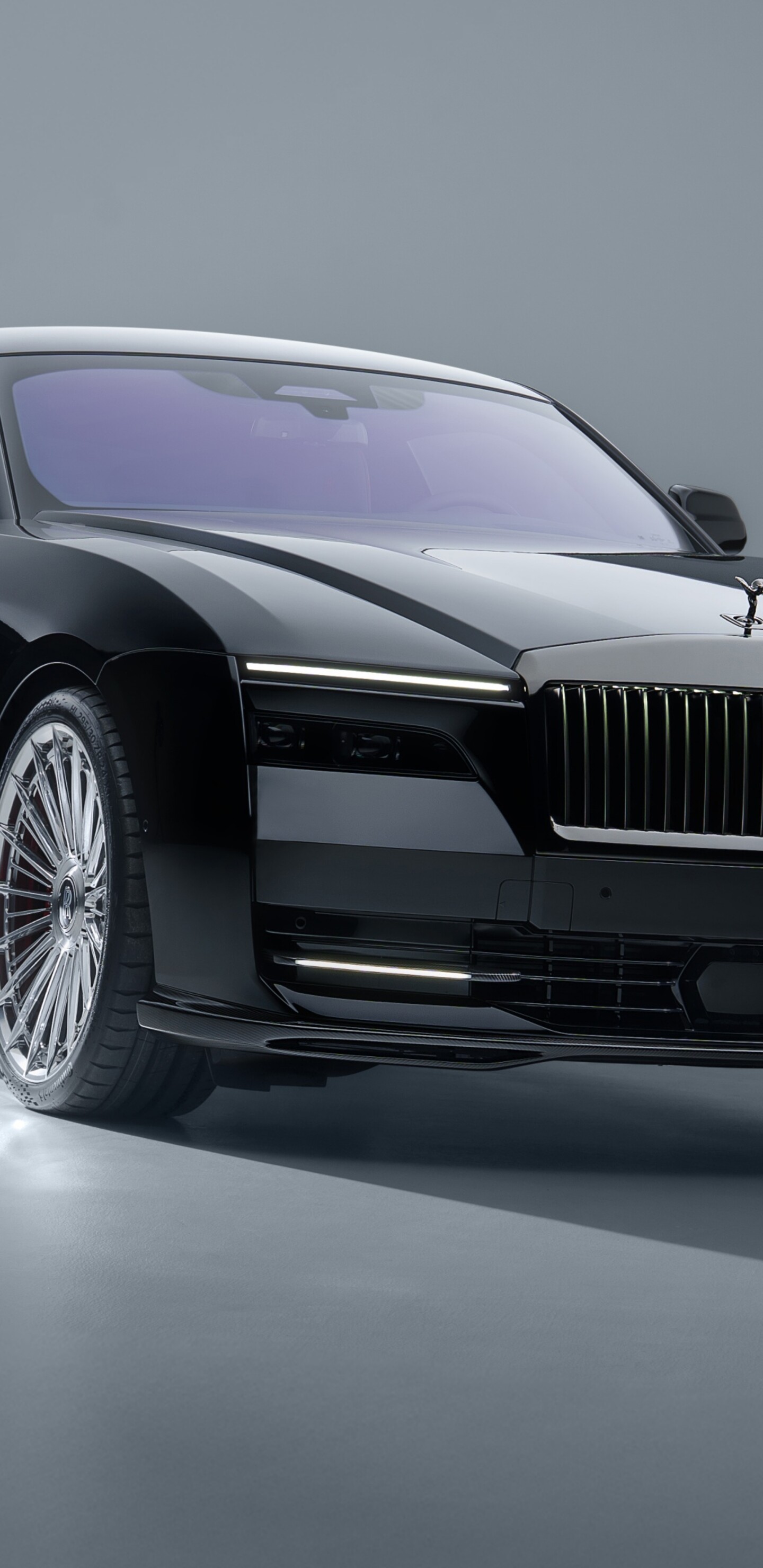 A 2025 Rolls-Royce Black Badge Spectre with SPOFEC customization set against a clean grey studio background.