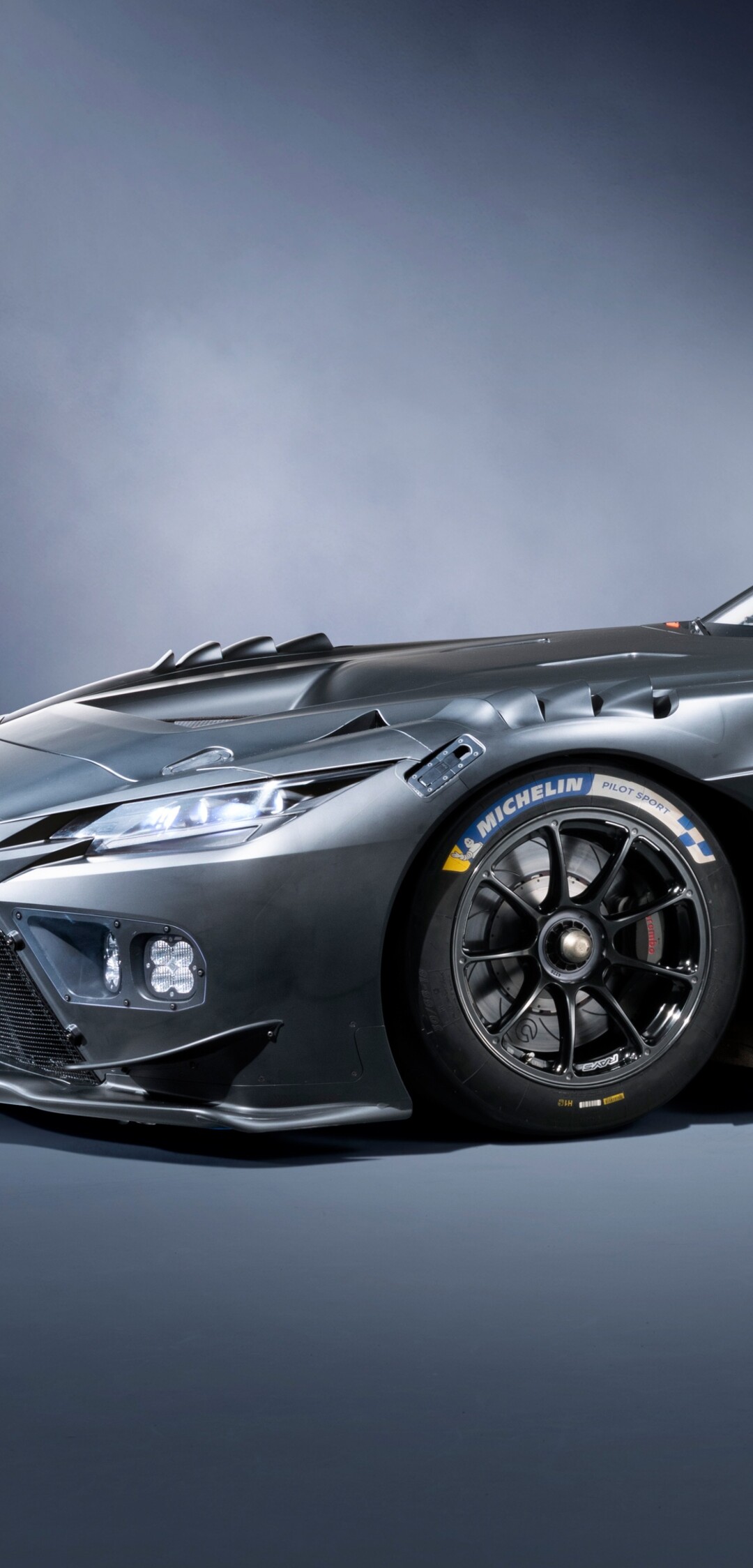 A sleek and aggressive 2025 Toyota GR GT3 prototype racing car featuring advanced aerodynamic elements and a modern racing livery.