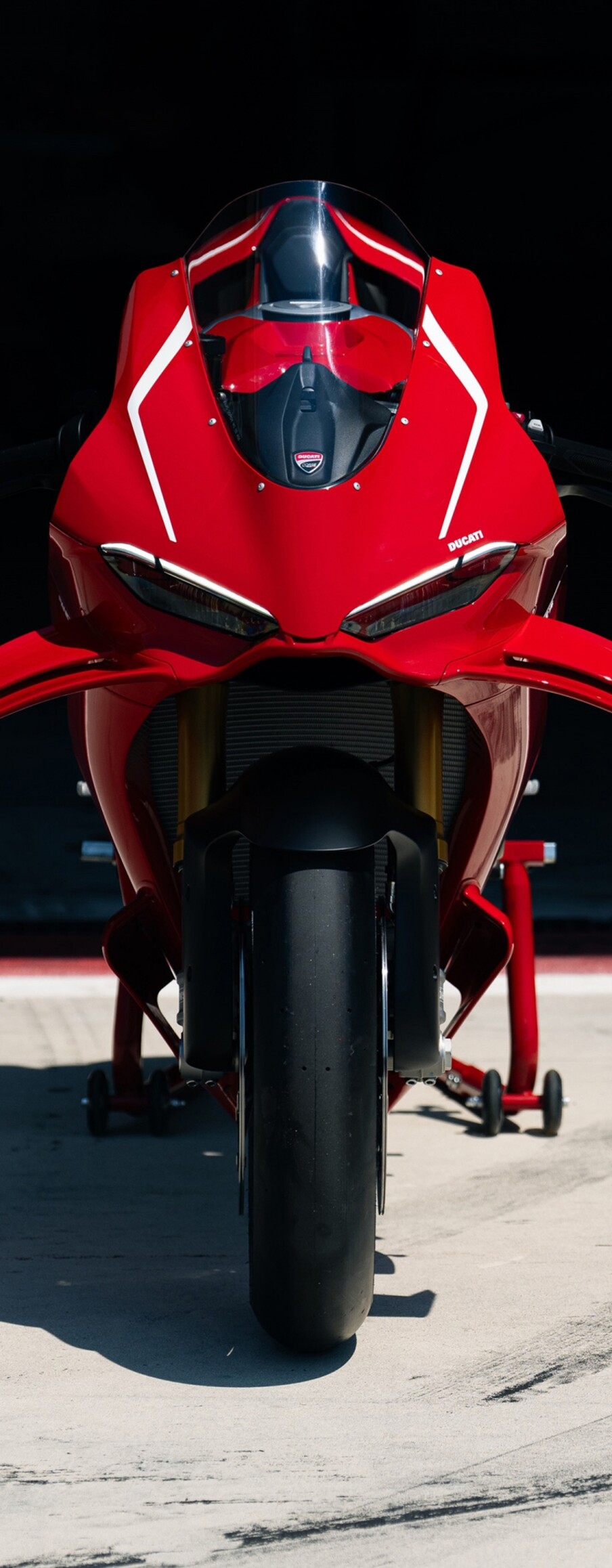 A high-detail shot of a vibrant red 2026 Ducati Panigale V4 R sports motorcycle.