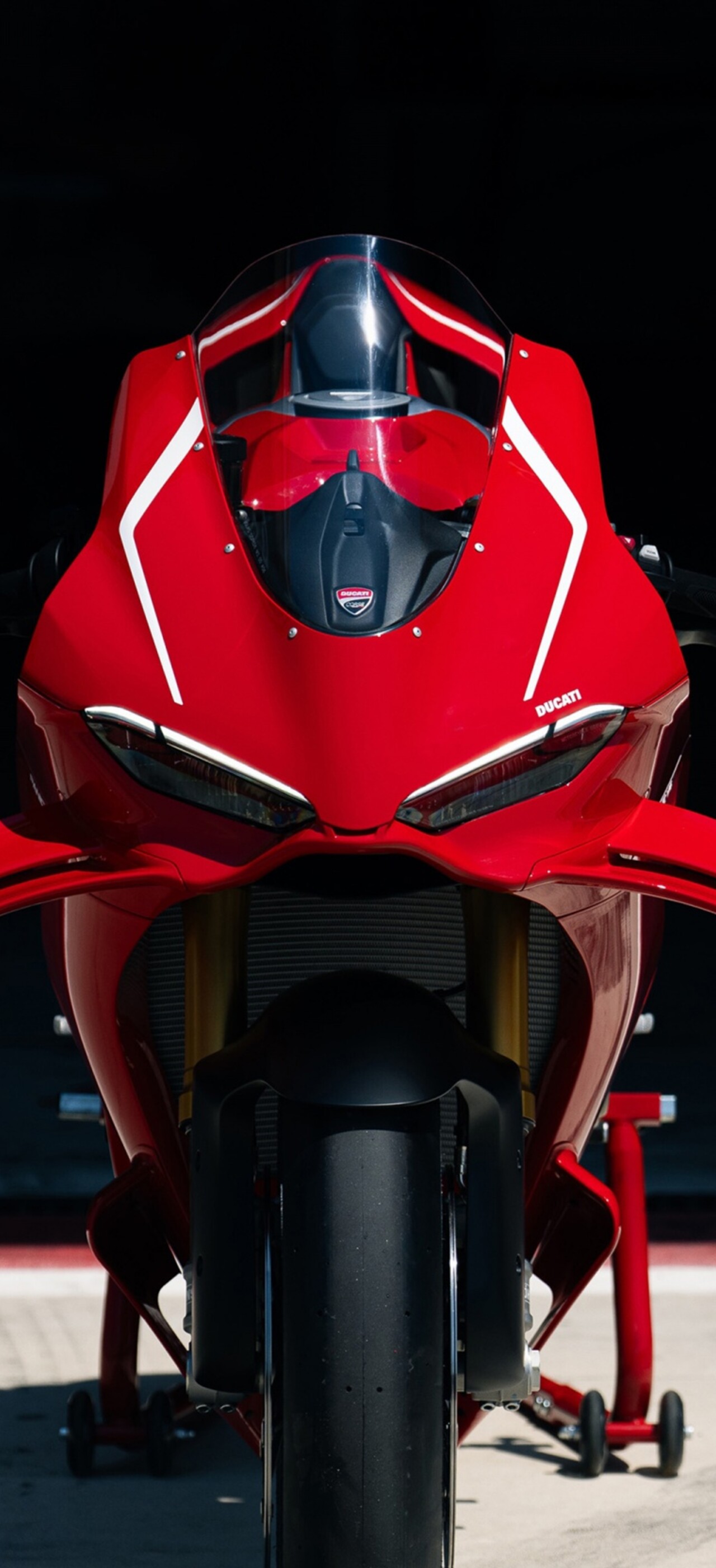 A sleek and powerful red 2026 Ducati Panigale V4 R sportbike featuring advanced aerodynamic bodywork.
