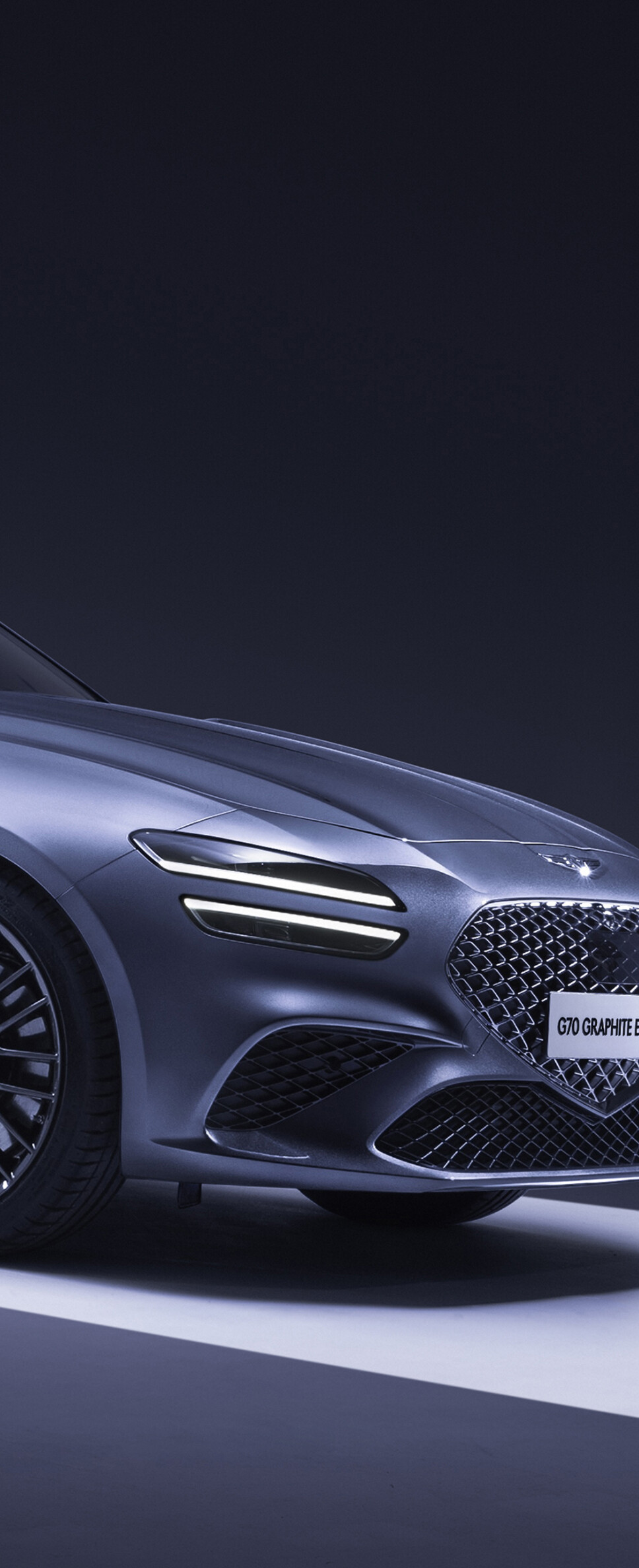 Futuristic 2026 Genesis G70 luxury sedan with sharp LED lighting and aerodynamic bodywork.