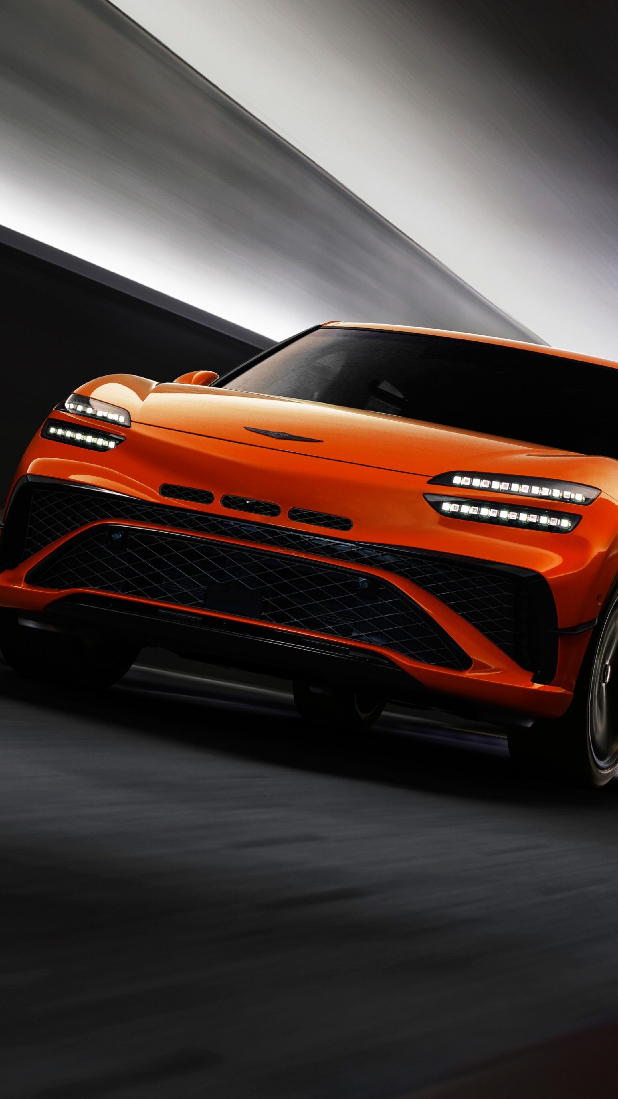 A high-detail, cinematic view of the 2026 Genesis GV60 Magma electric performance vehicle.