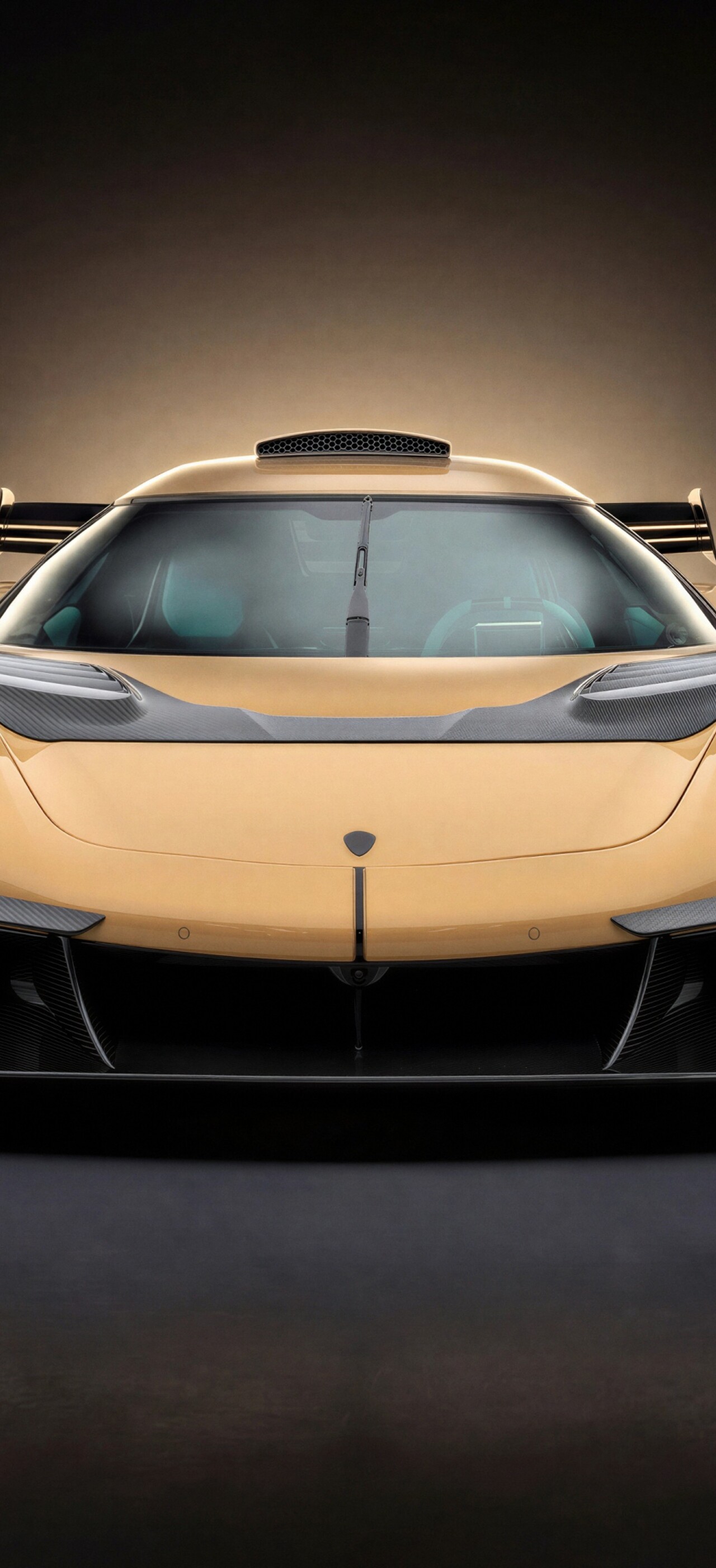 A cinematic, dark-themed shot of a modified Koenigsegg Jesko Mansory edition hypercar with sleek aerodynamic features.