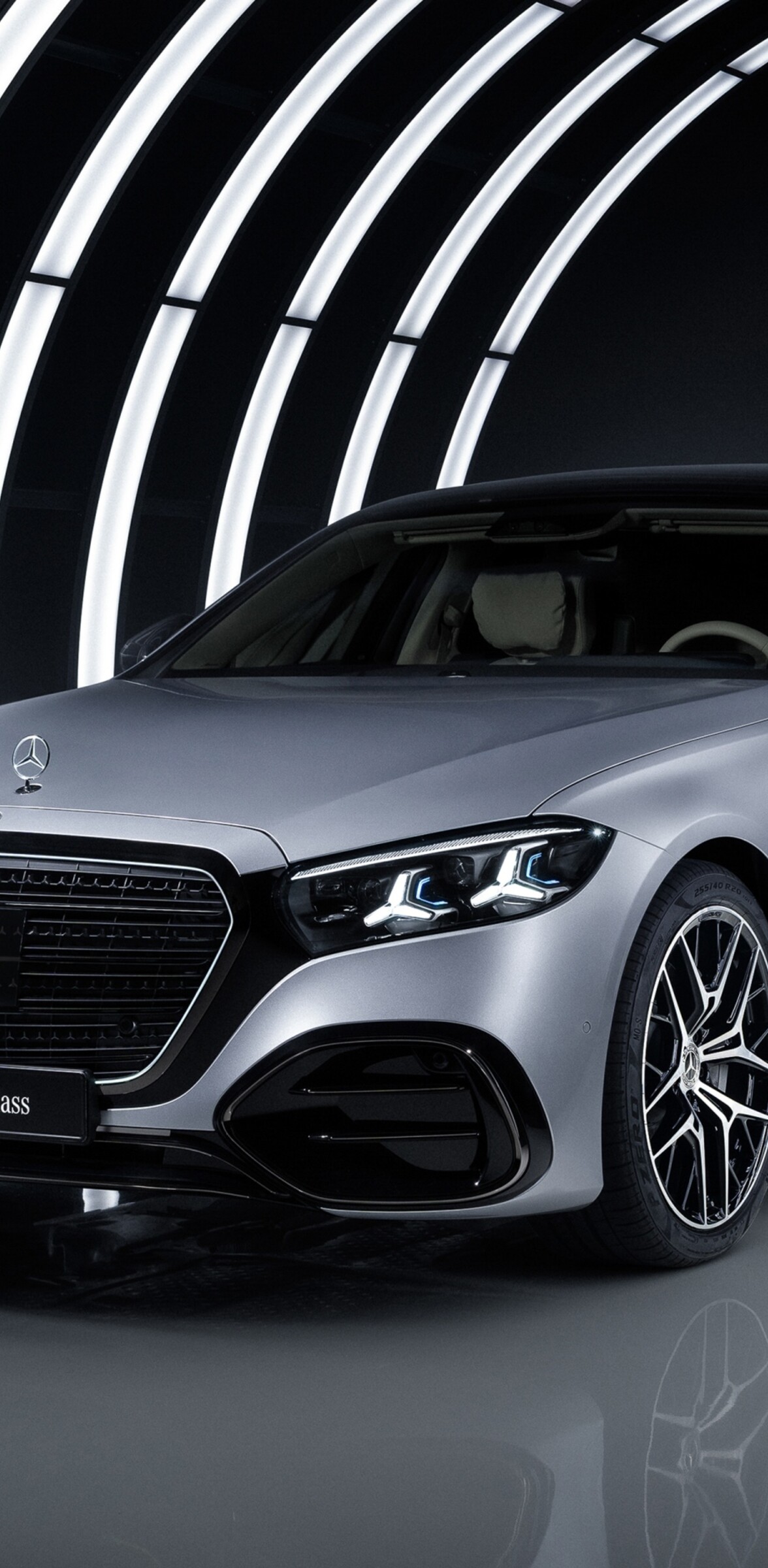 A sleek 2026 Mercedes-Benz S 580 e 4MATIC AMG Line featuring dark aesthetic and dramatic LED lighting.