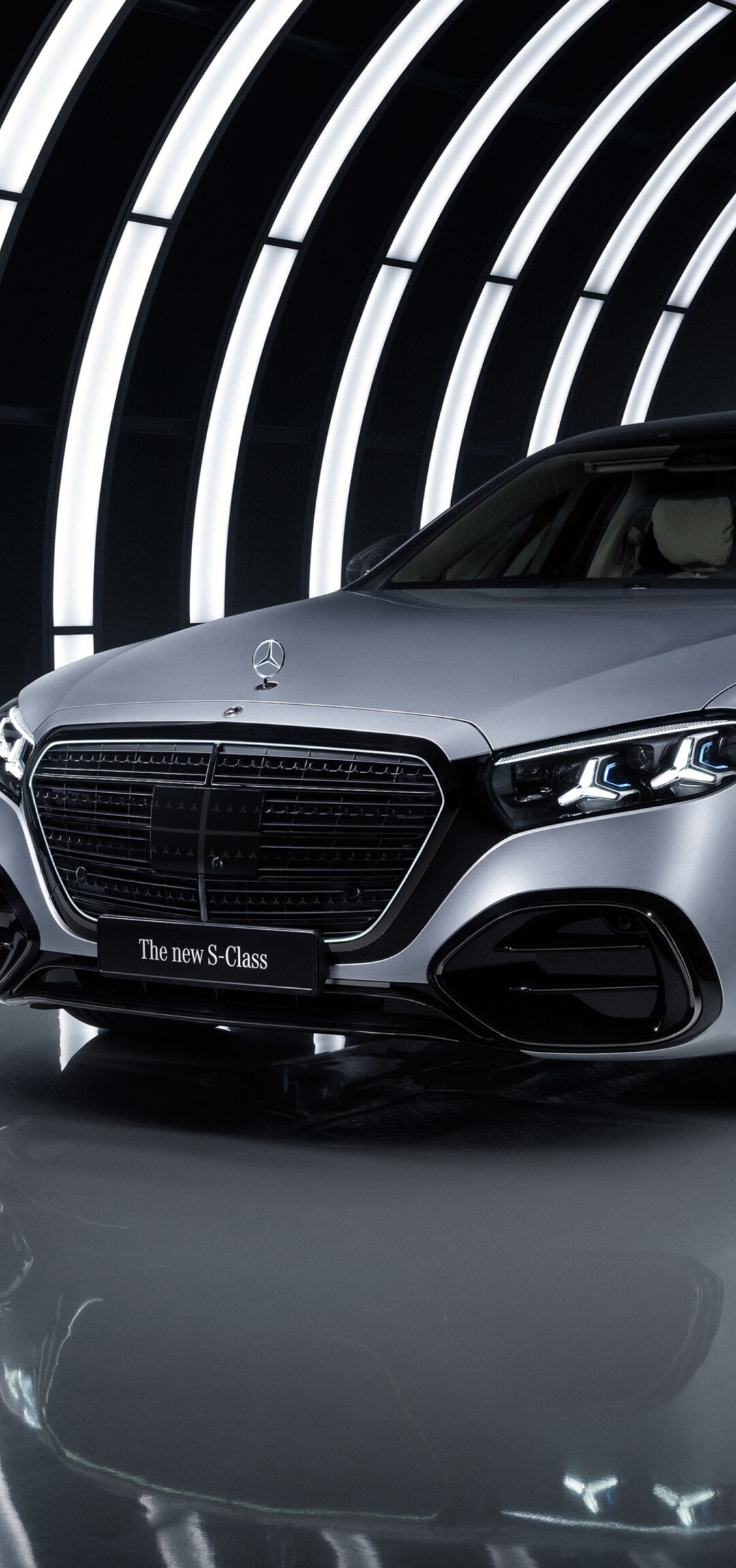 A dark aesthetic shot of the 2026 Mercedes-Benz S 580 e 4MATIC AMG Line with prominent LED lighting.