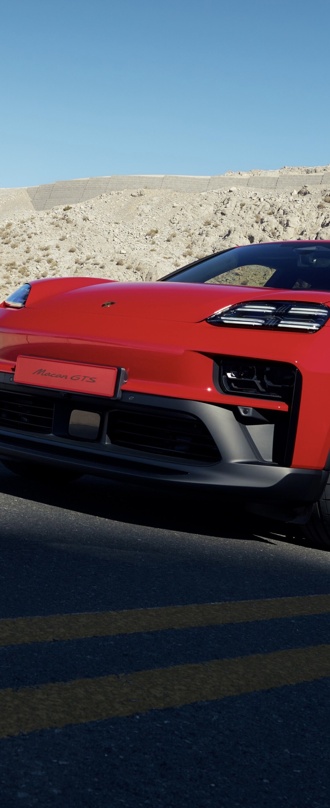 A sleek and powerful red 2026 Porsche Macan GTS luxury SUV shown in high detail.