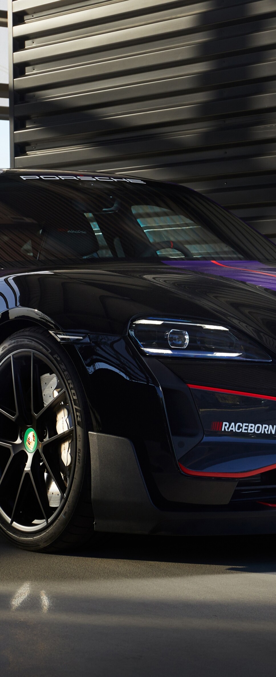 A sleek and aerodynamic 2026 Porsche Taycan Turbo GT electric race car.