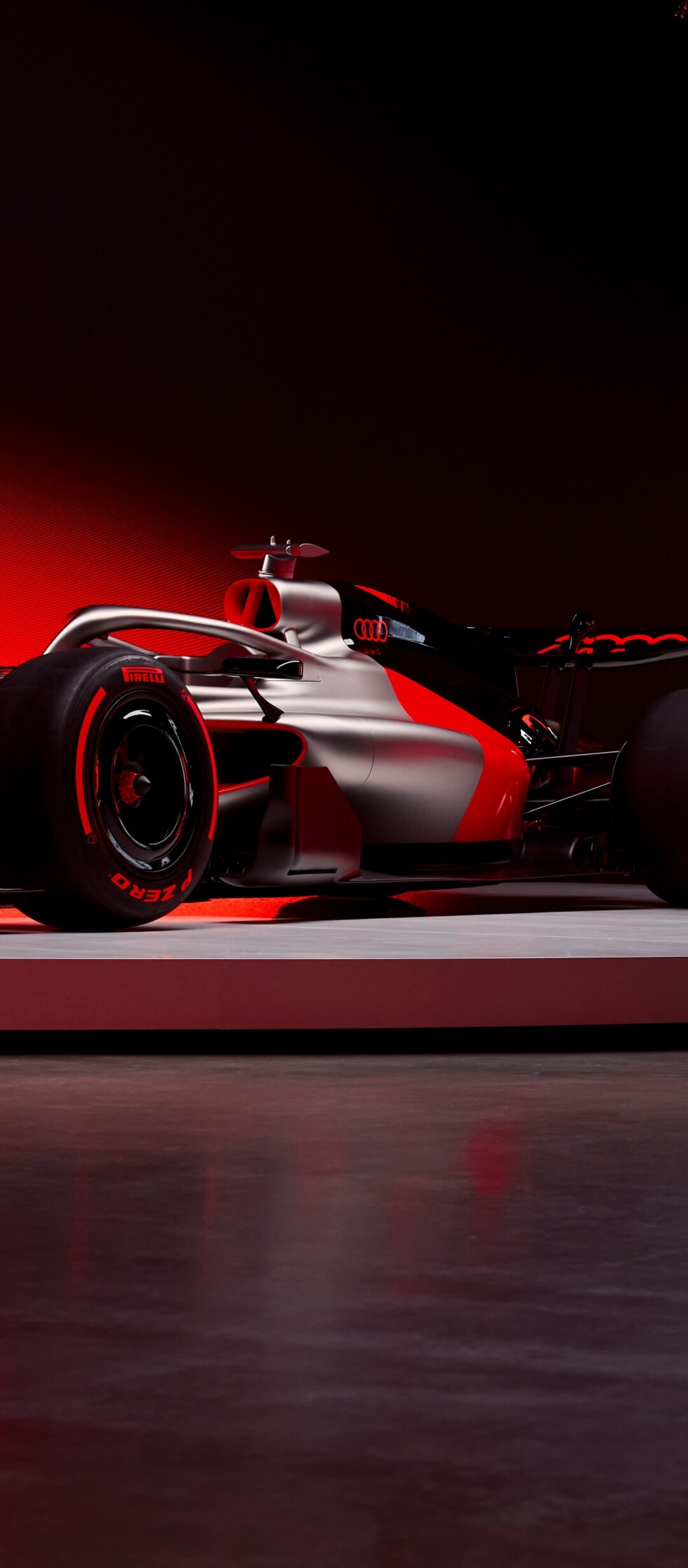 Futuristic Audi R26 Concept F1 racing car in a sleek dark red finish.