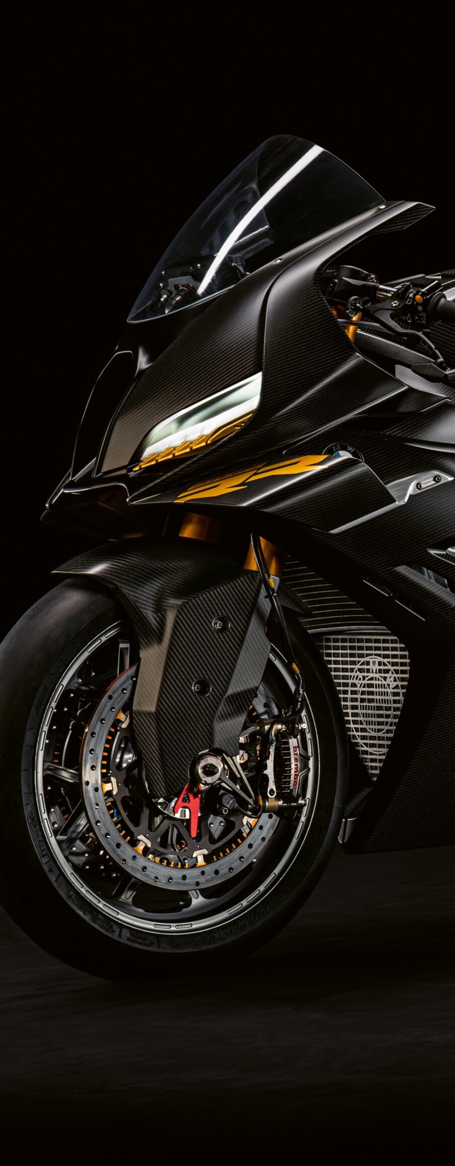 A futuristic BMW Motorrad Concept RR 2026 superbike with sleek aerodynamic lines on a dark background