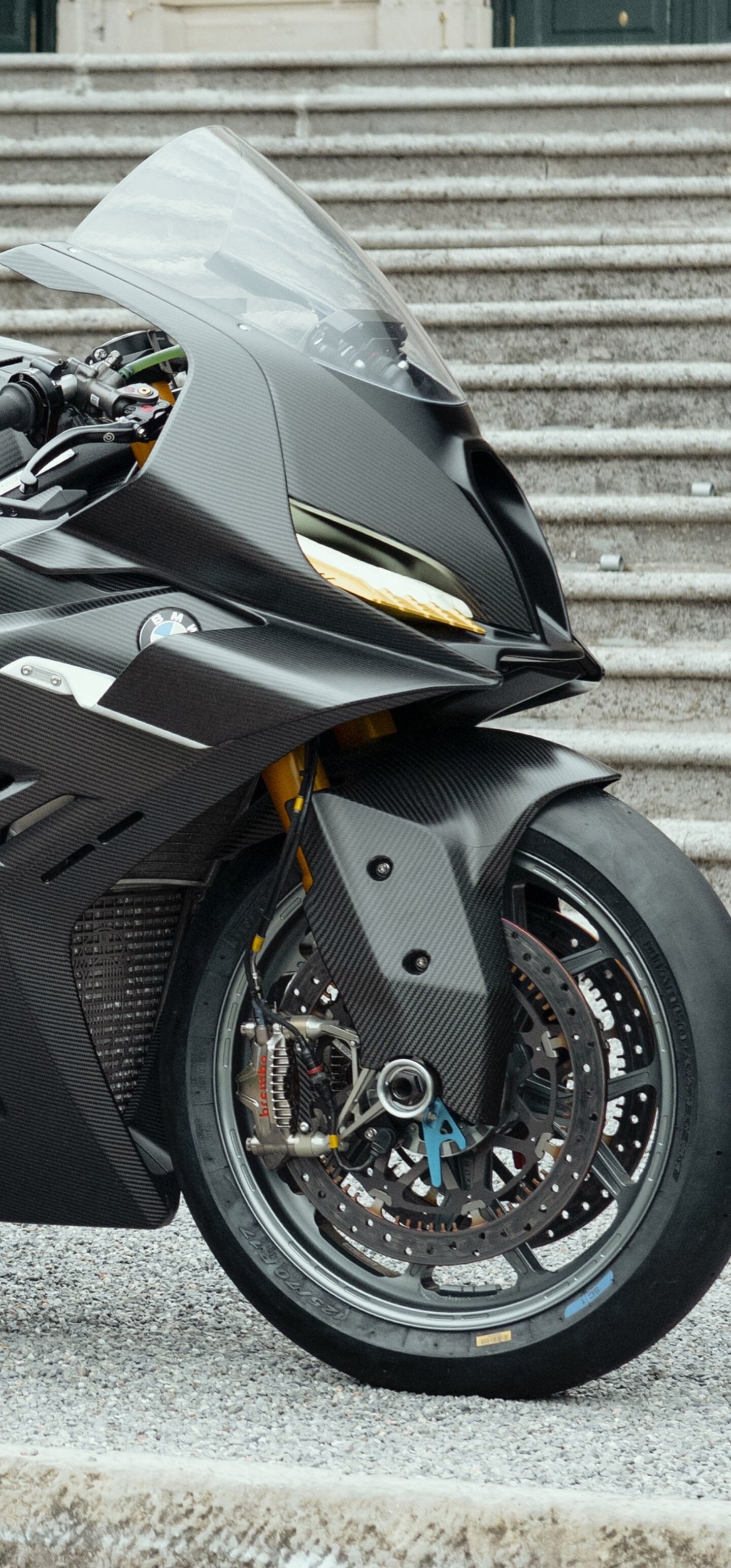 A futuristic BMW Motorrad Concept RR sports motorcycle featuring advanced aerodynamic fairings and a sleek, aggressive design.