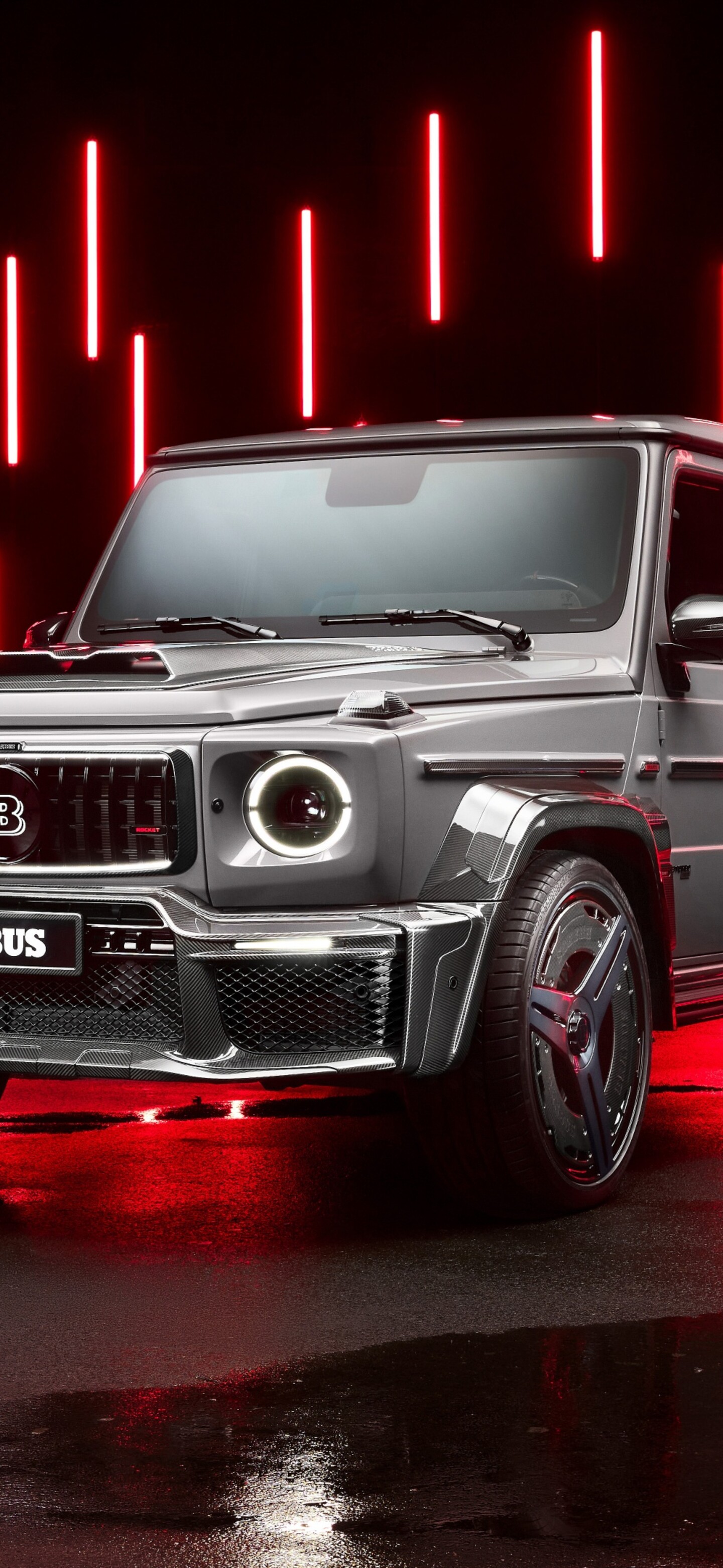 A luxurious Brabus 900 Mercedes-AMG G 63 with a vibrant red aesthetic and glowing LED lights.