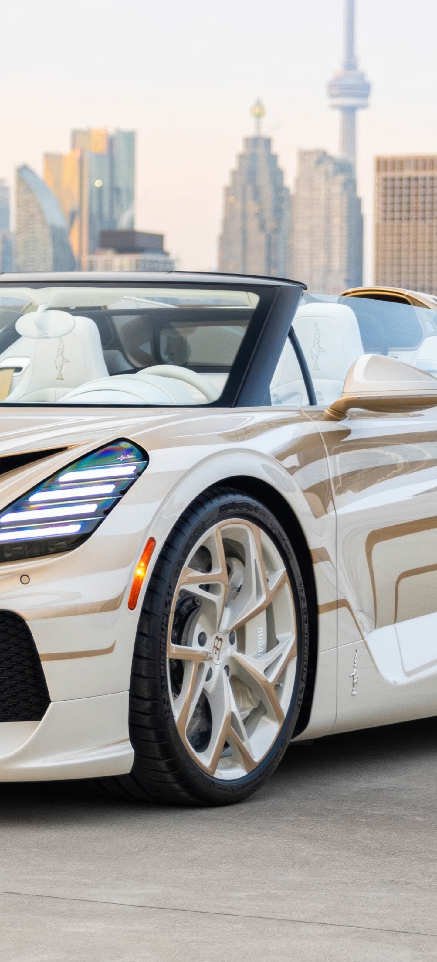 A high-resolution, detailed shot of the Bugatti W16 Mistral hypercar, showcasing its sleek aerodynamic curves and premium finish.