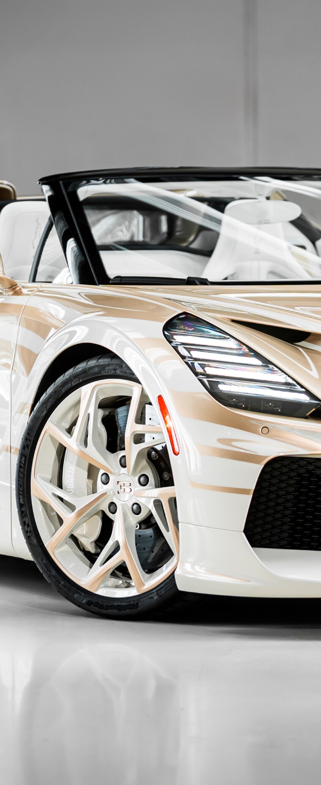 A high-detail, cinematic shot of the Bugatti W16 Mistral hypercar featuring its aerodynamic design.